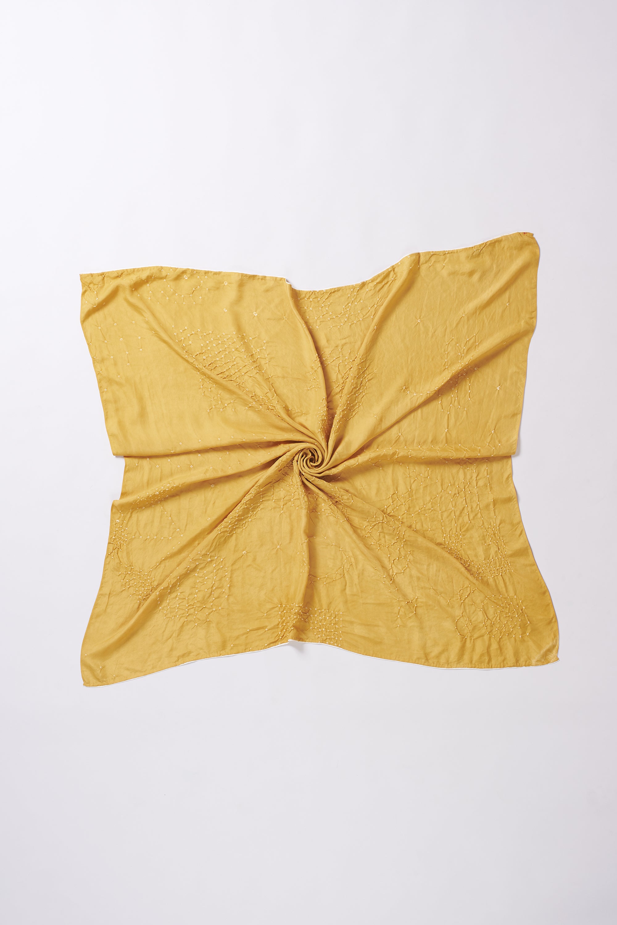 Yellow fabric swatch with a knot