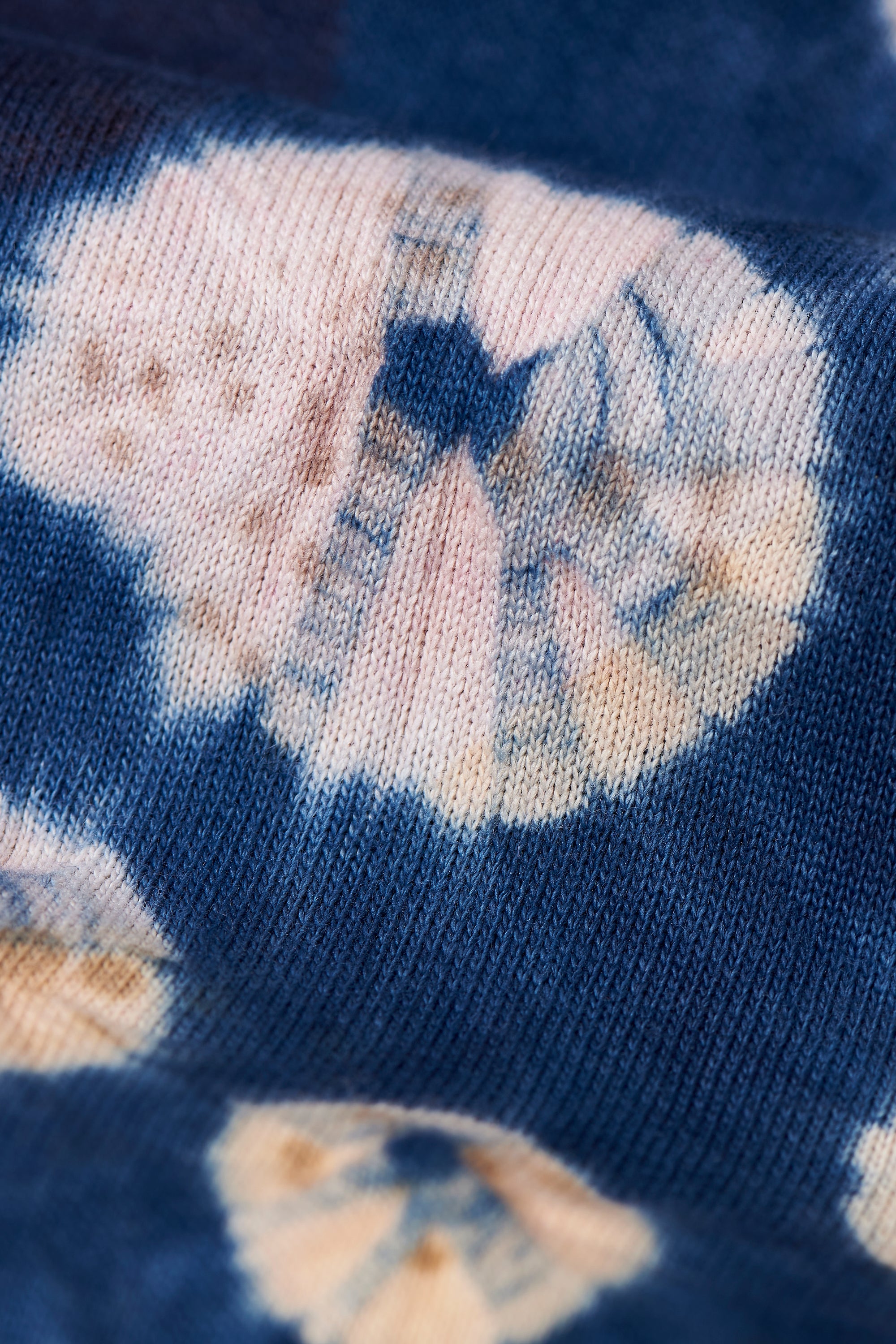 A woman wearing medium indigo sweatshirt