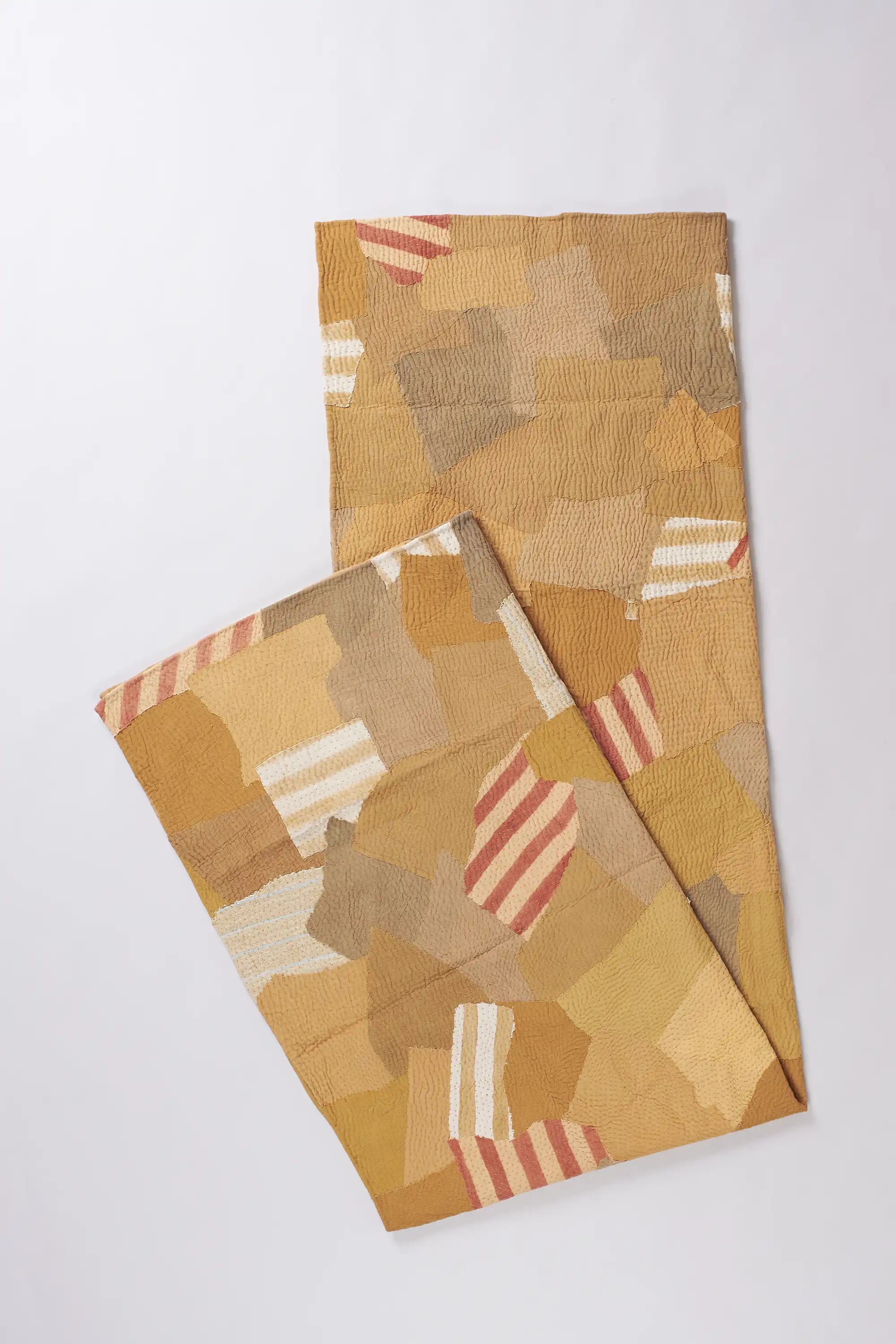 Folded yellow quilt