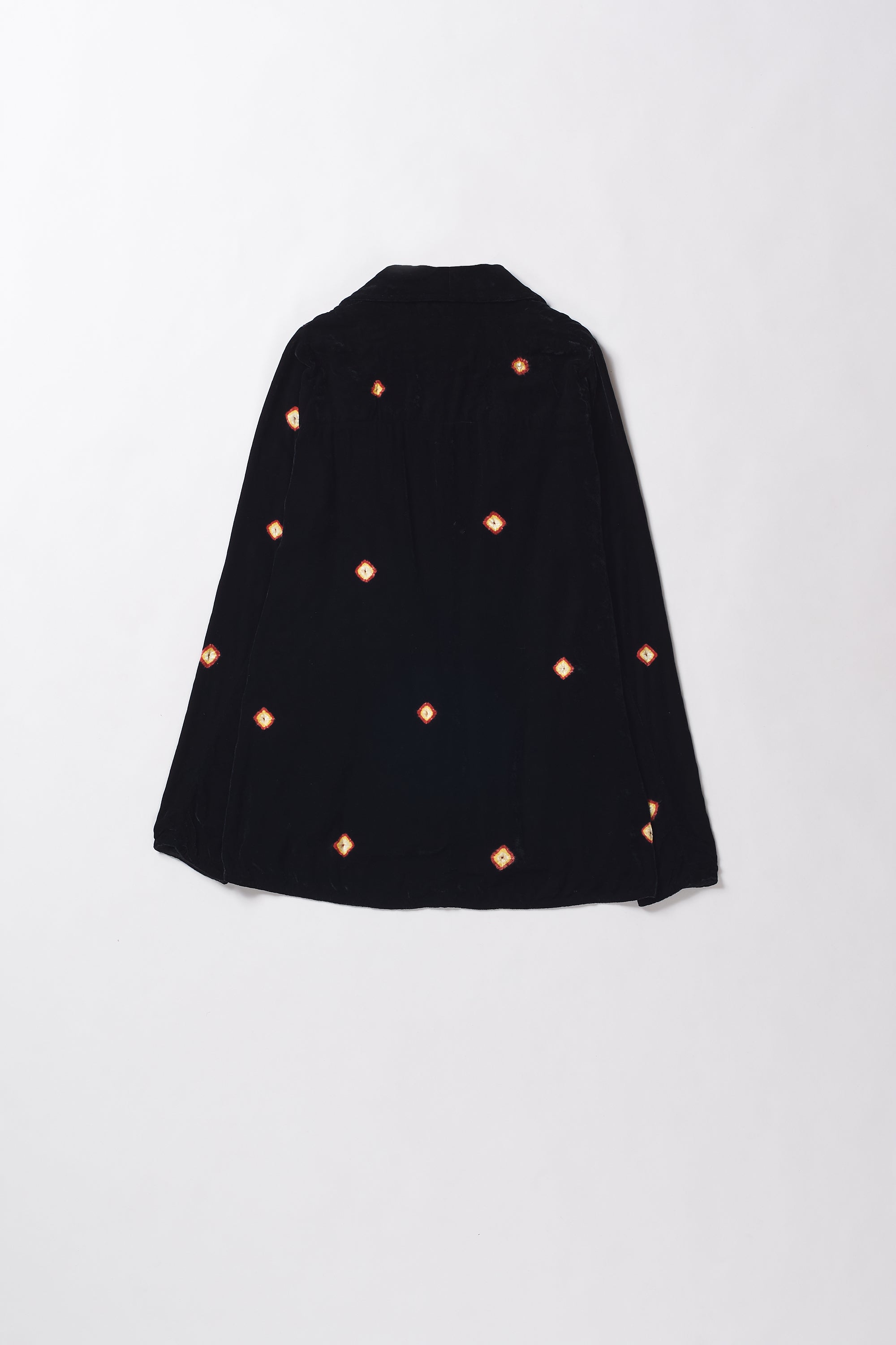 Black cape with orange polka dots