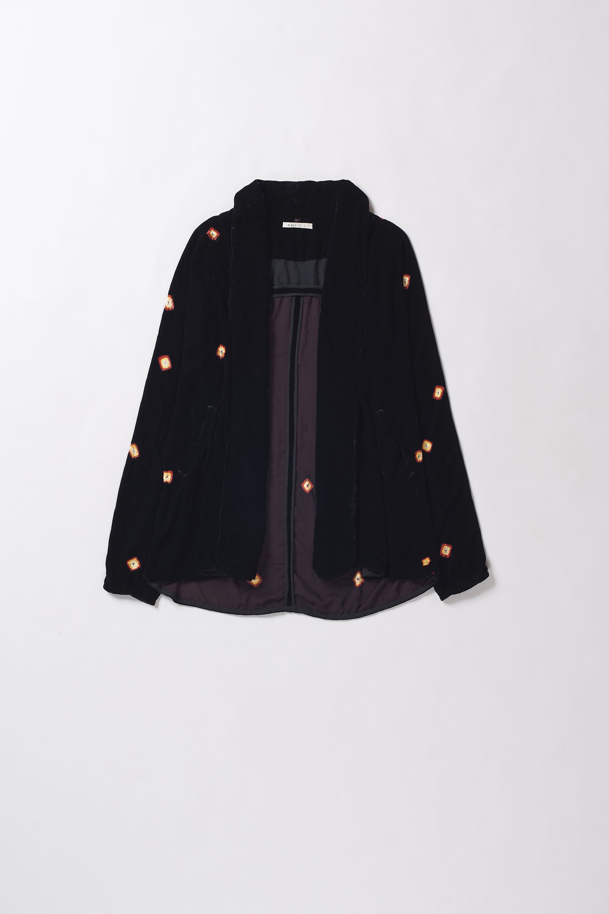 Black jacket with small orange buttons