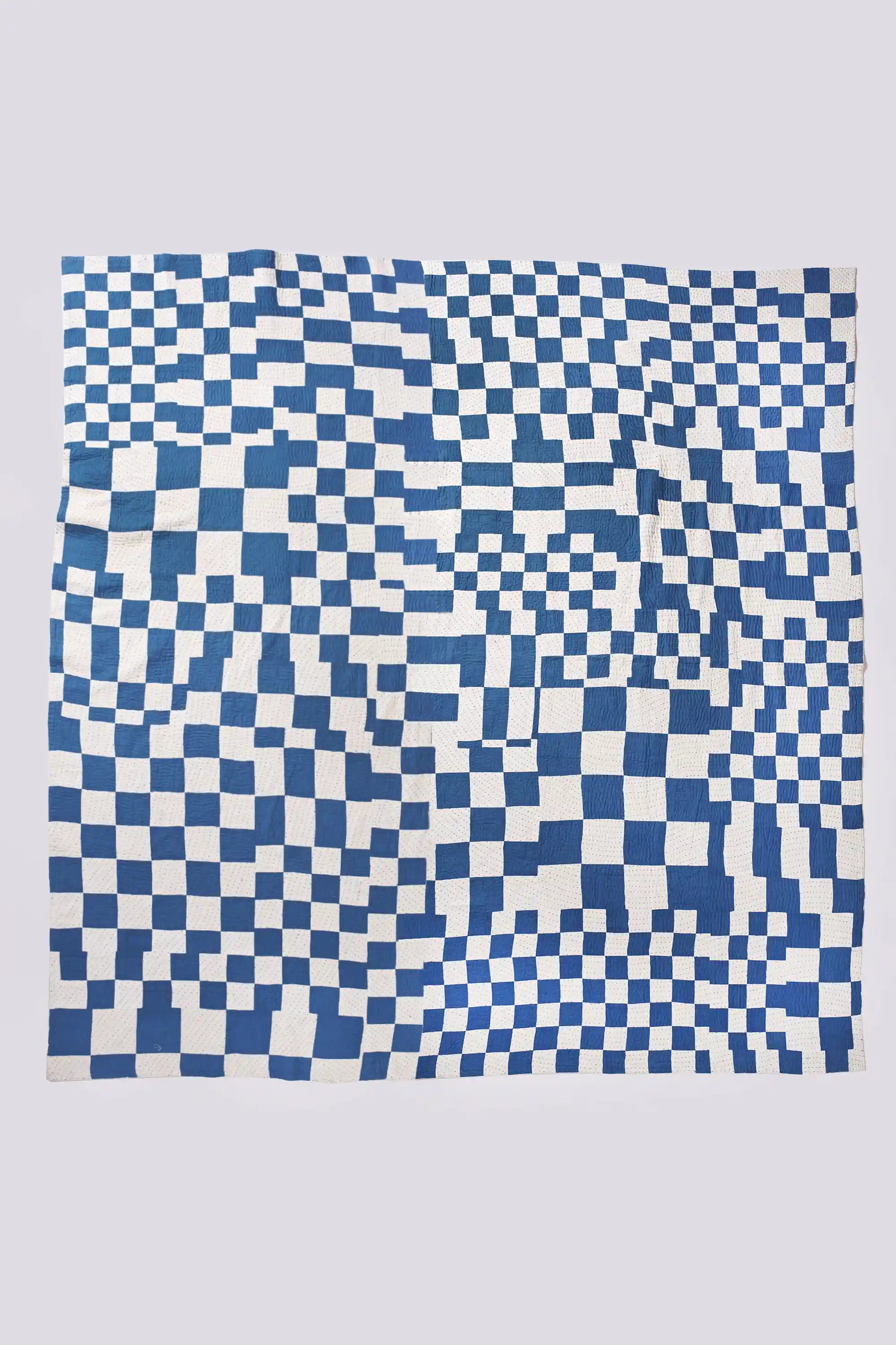 Blue and white checkered pattern on a light gray background