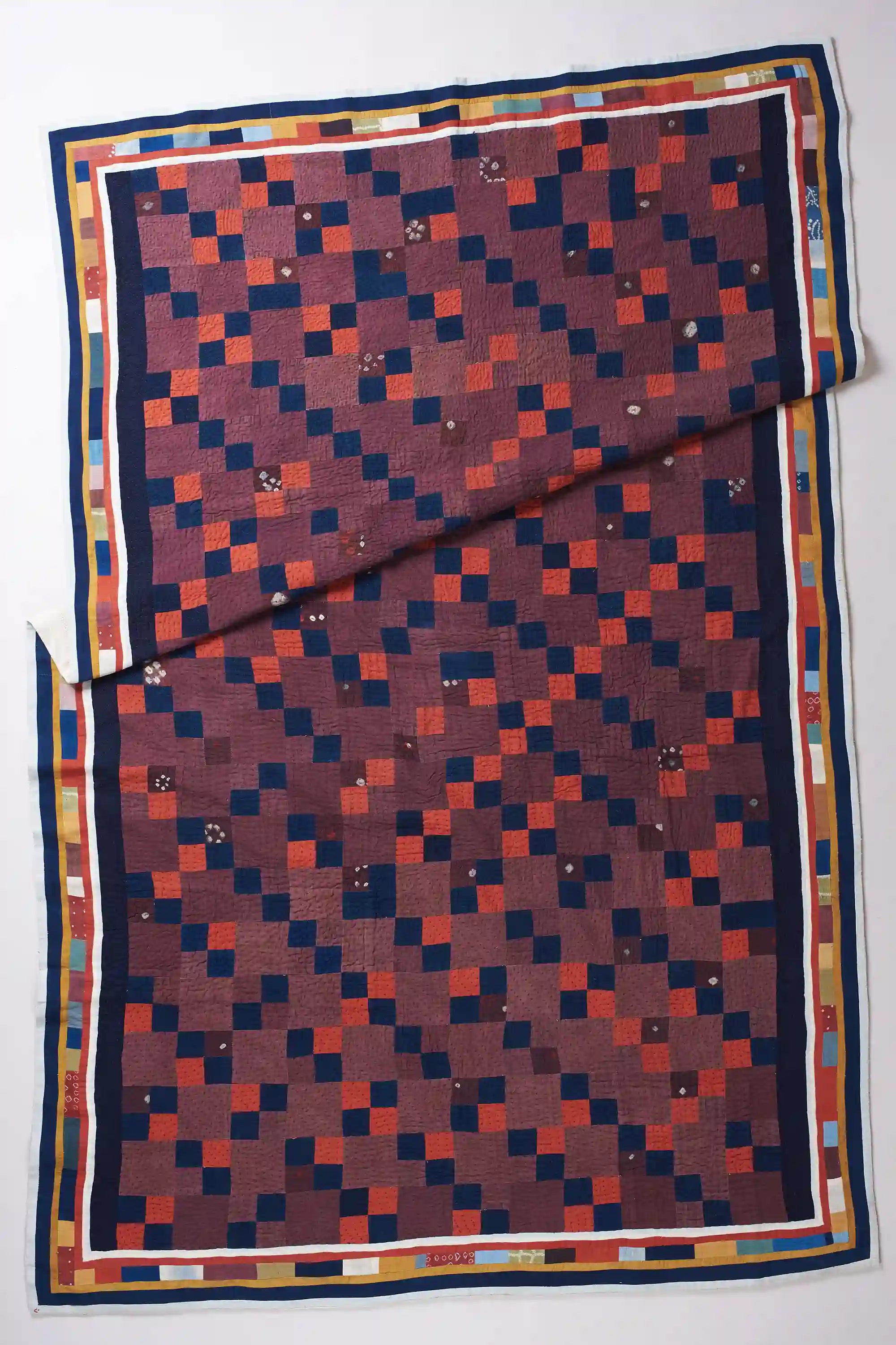 Geometric patterned fabric with a checkered design on a white background