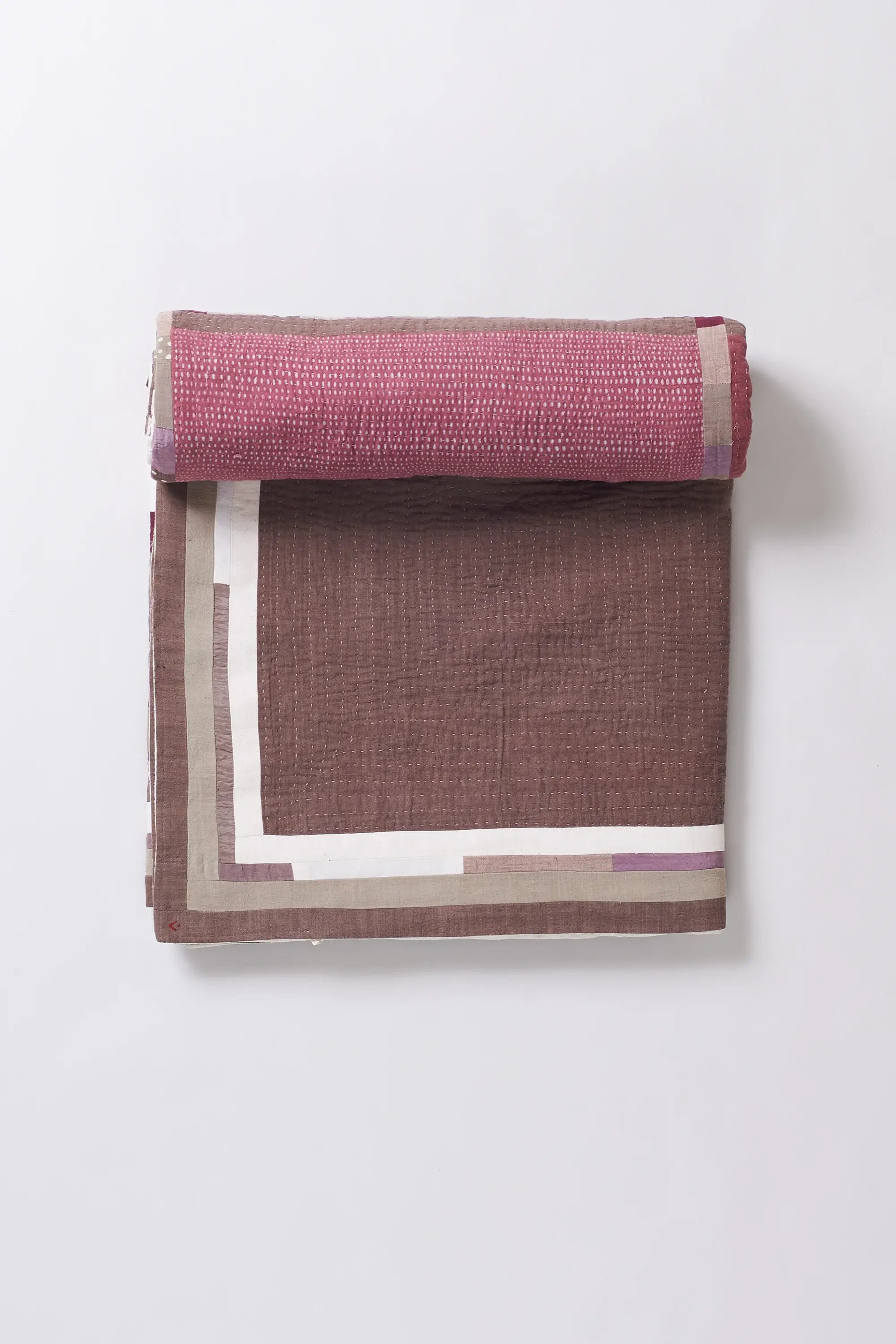 Colorful patterned fabric roll on a white background