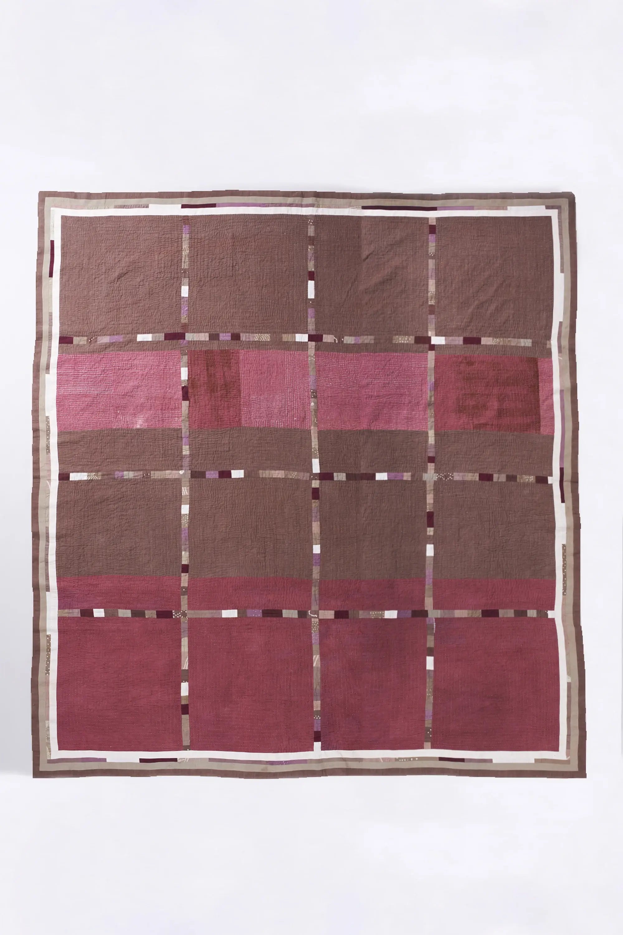 Patchwork quilt in shades of wine