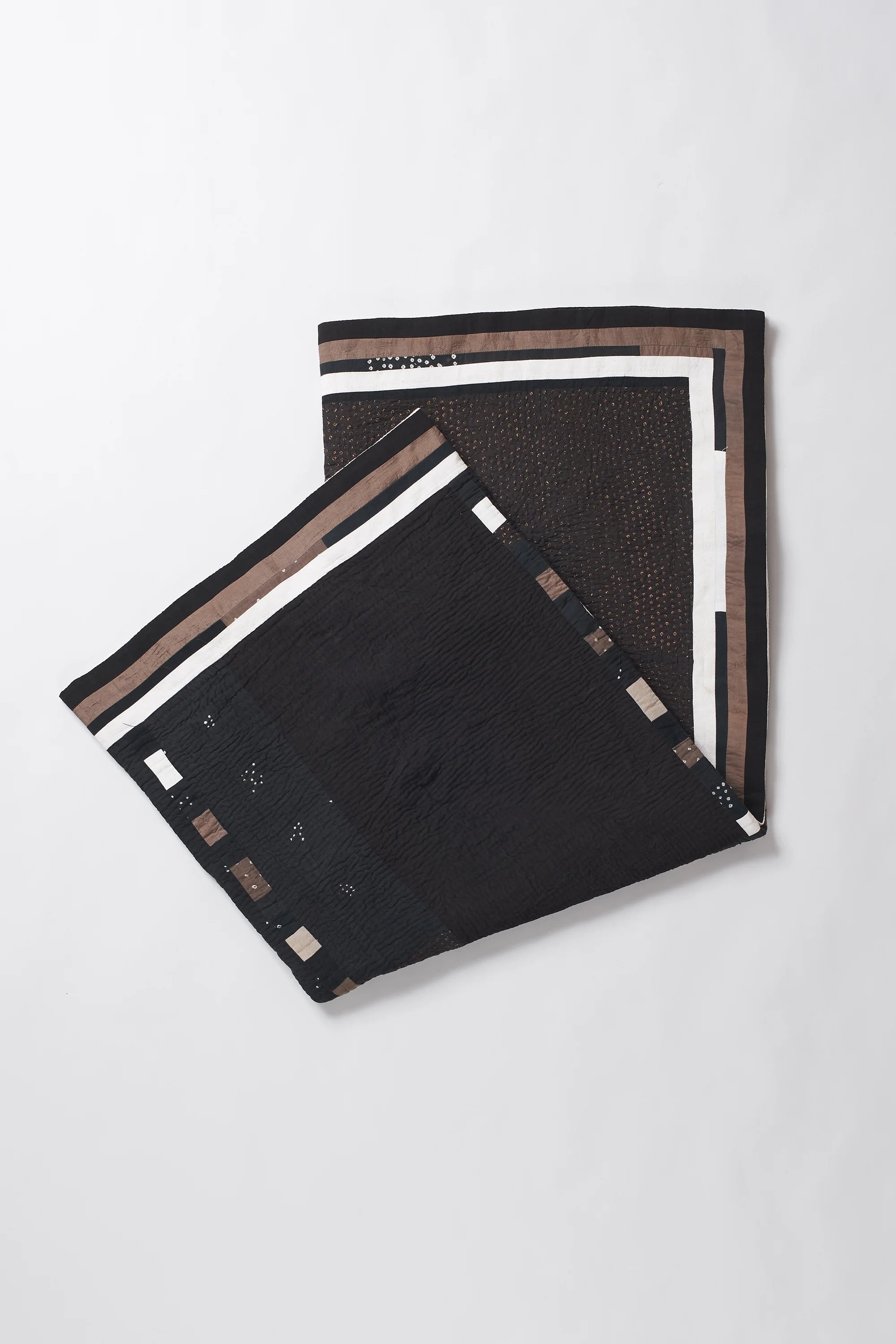 Folded fabric with white and black pattern on a white background