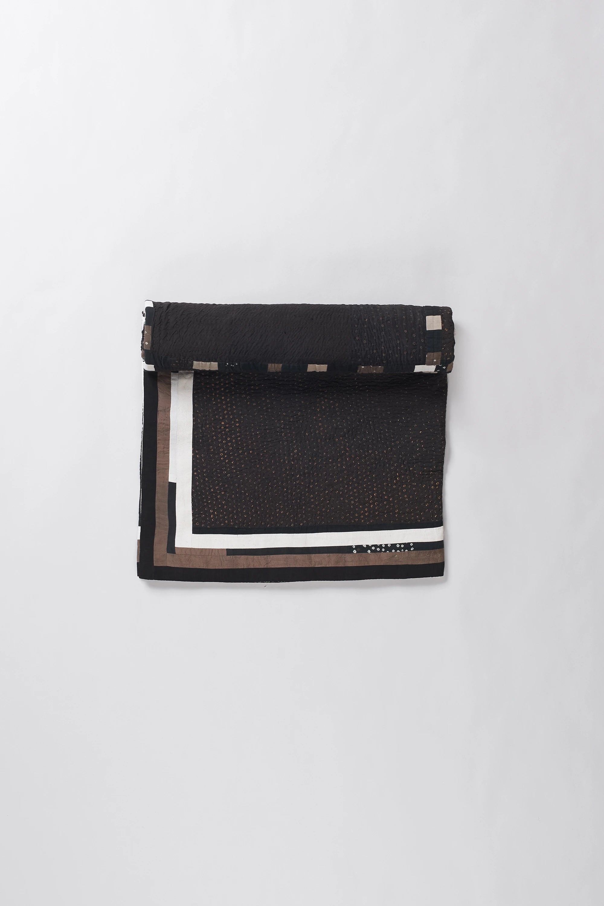 Colorful patterned fabric roll on a white background