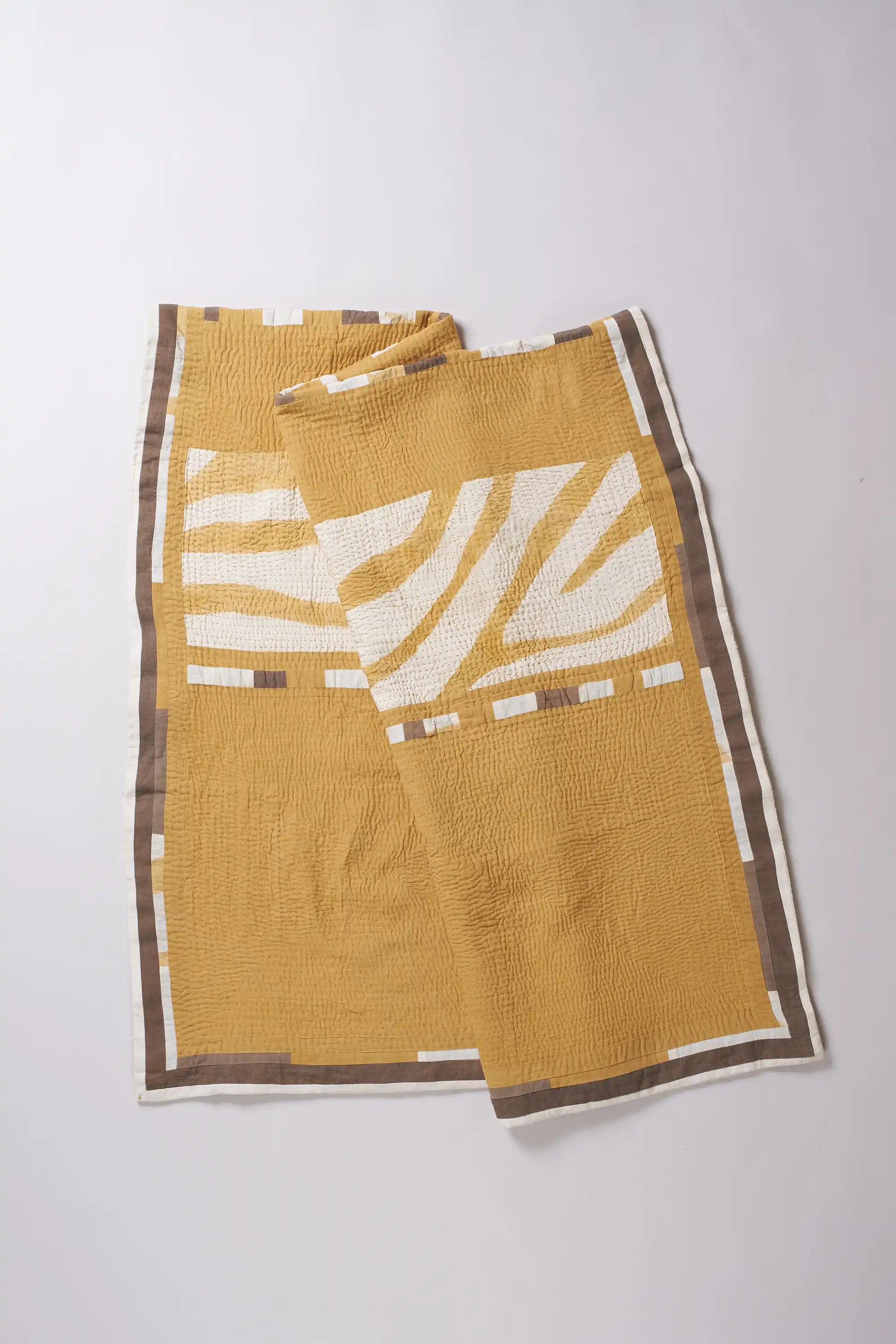 Patchwork quilt in shades of yellow