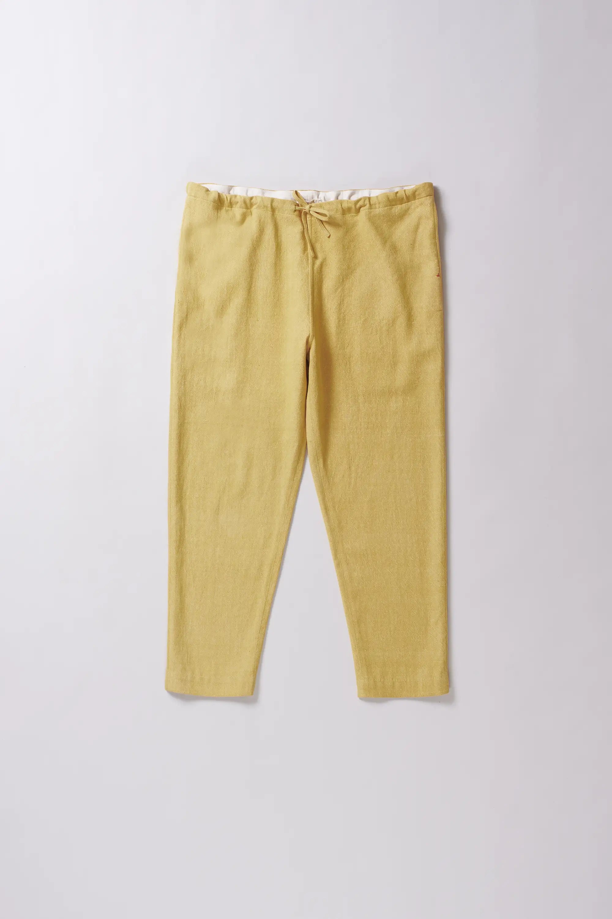Front image of a cotton ochre yellow pants