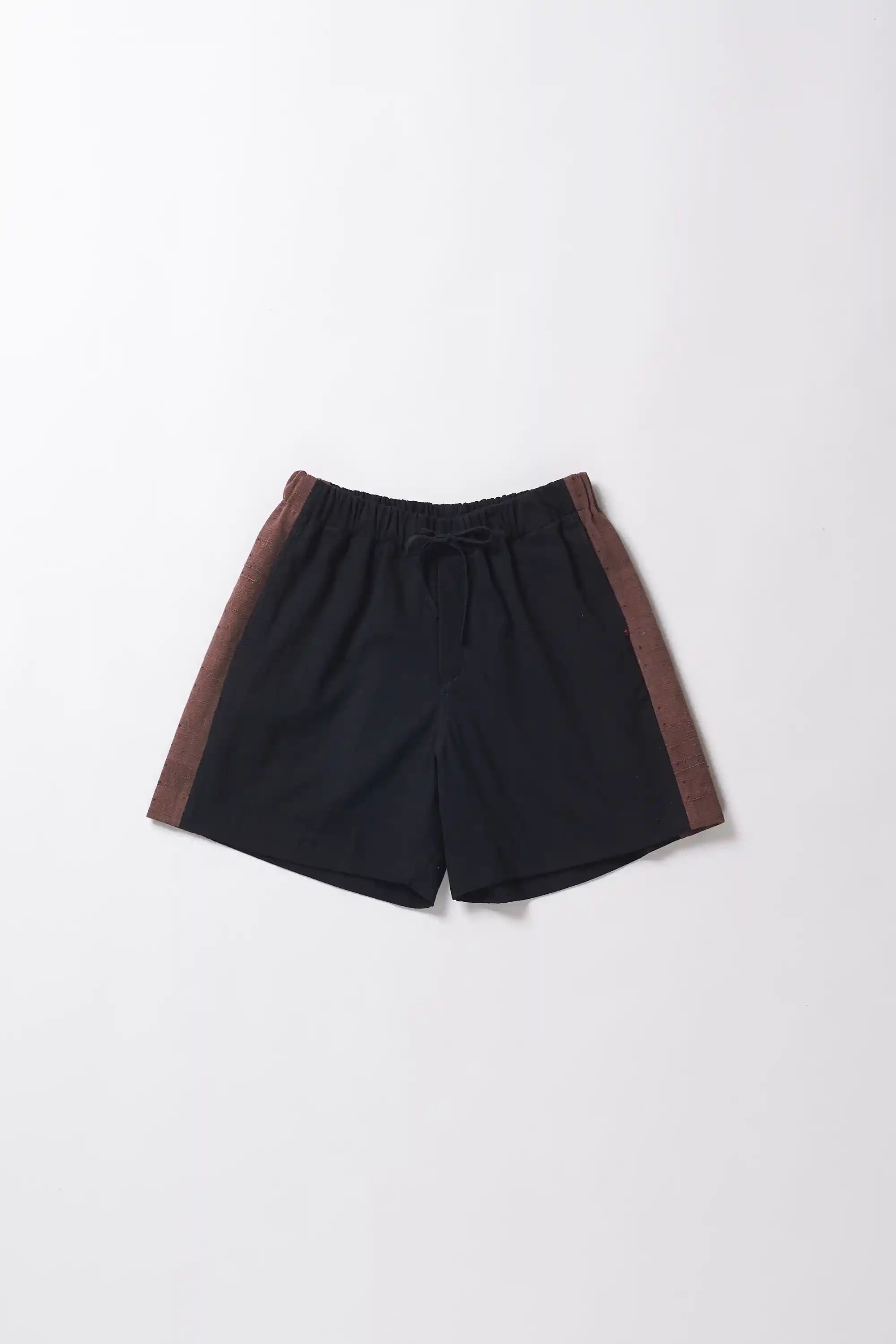 Black shorts with brown accents on a white background