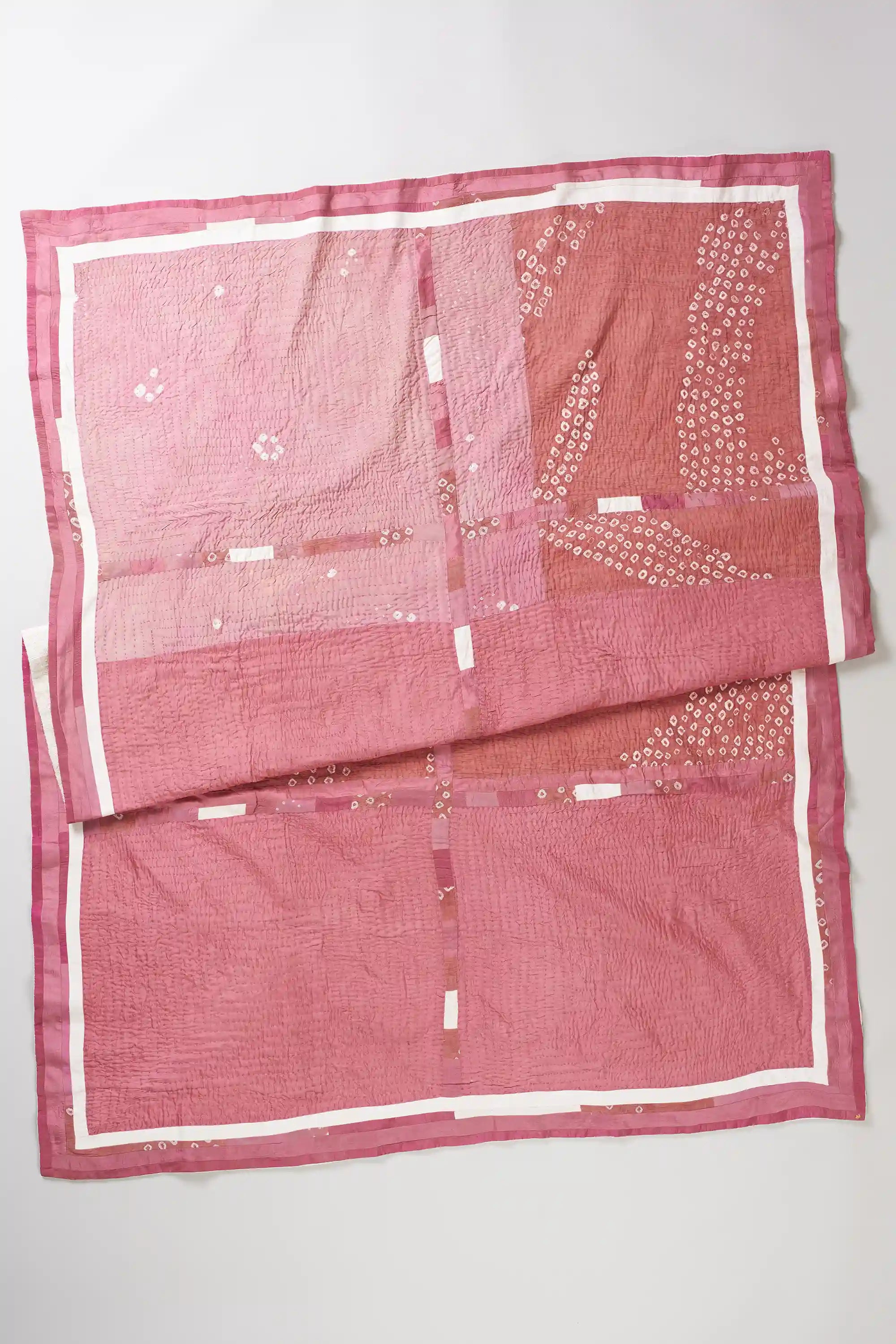 Folded light pink quilt