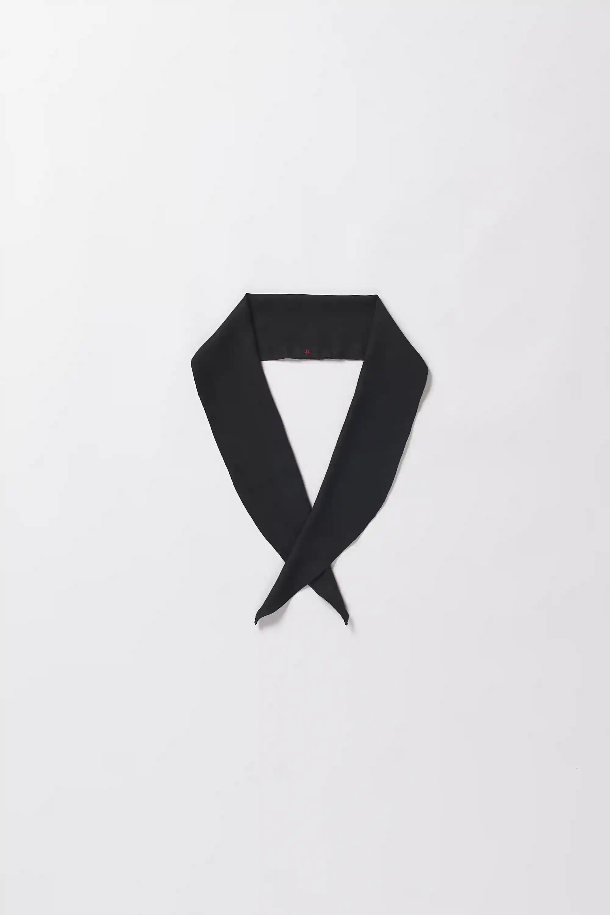 Black scarf on a light grey background