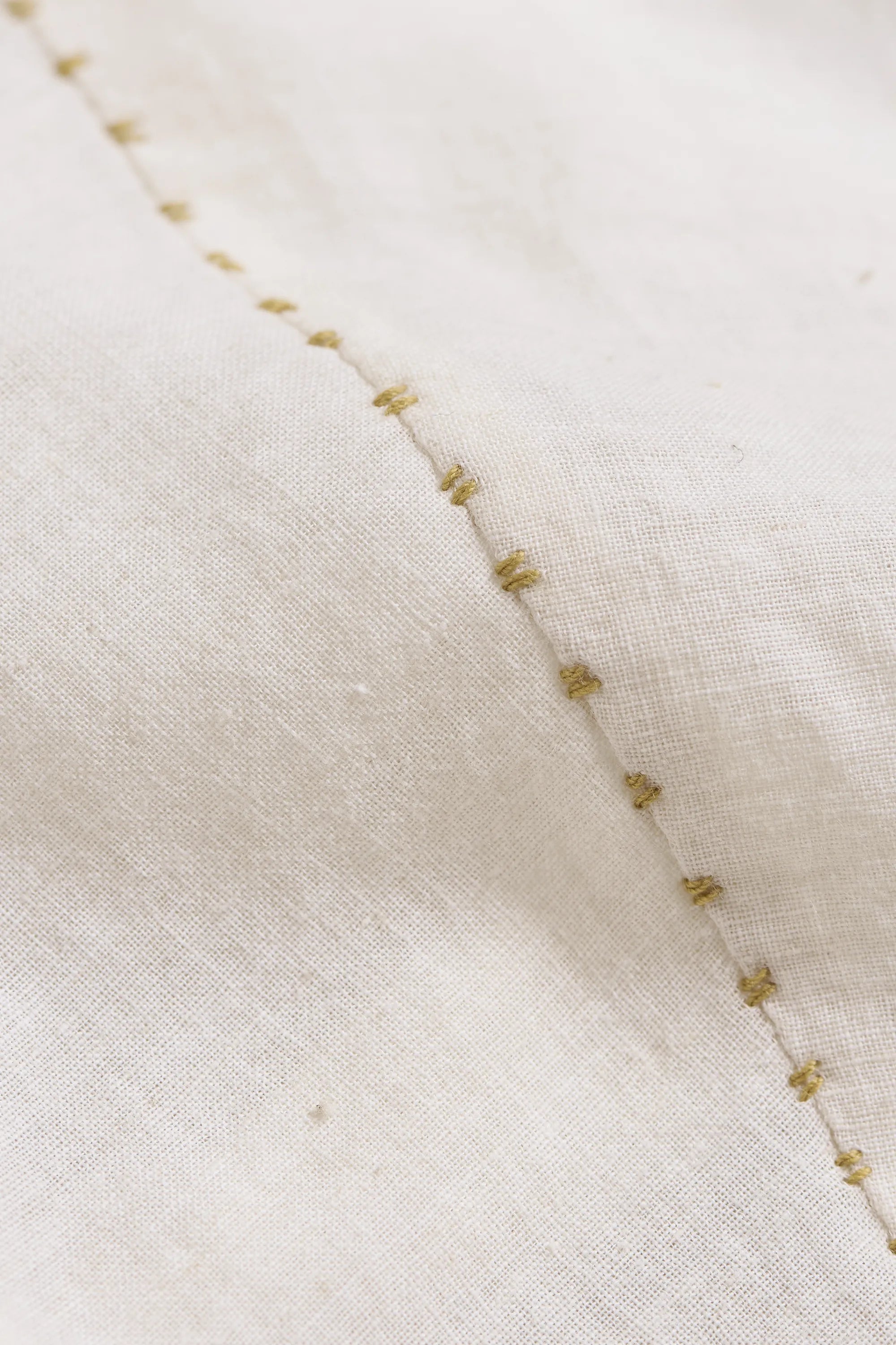 Close-up of a fabric with a hand detailing