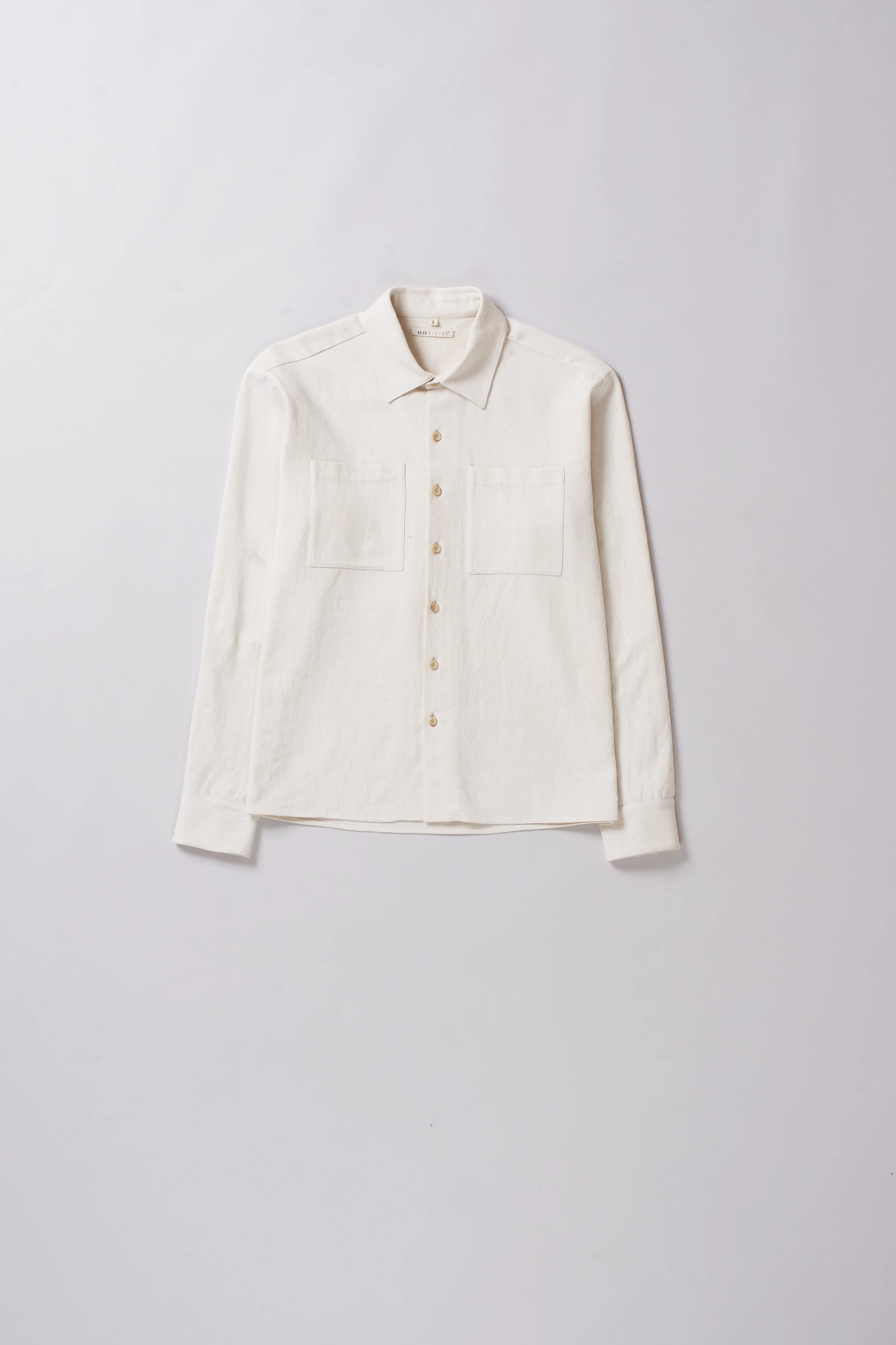 Front image of a ecru cotton shirt