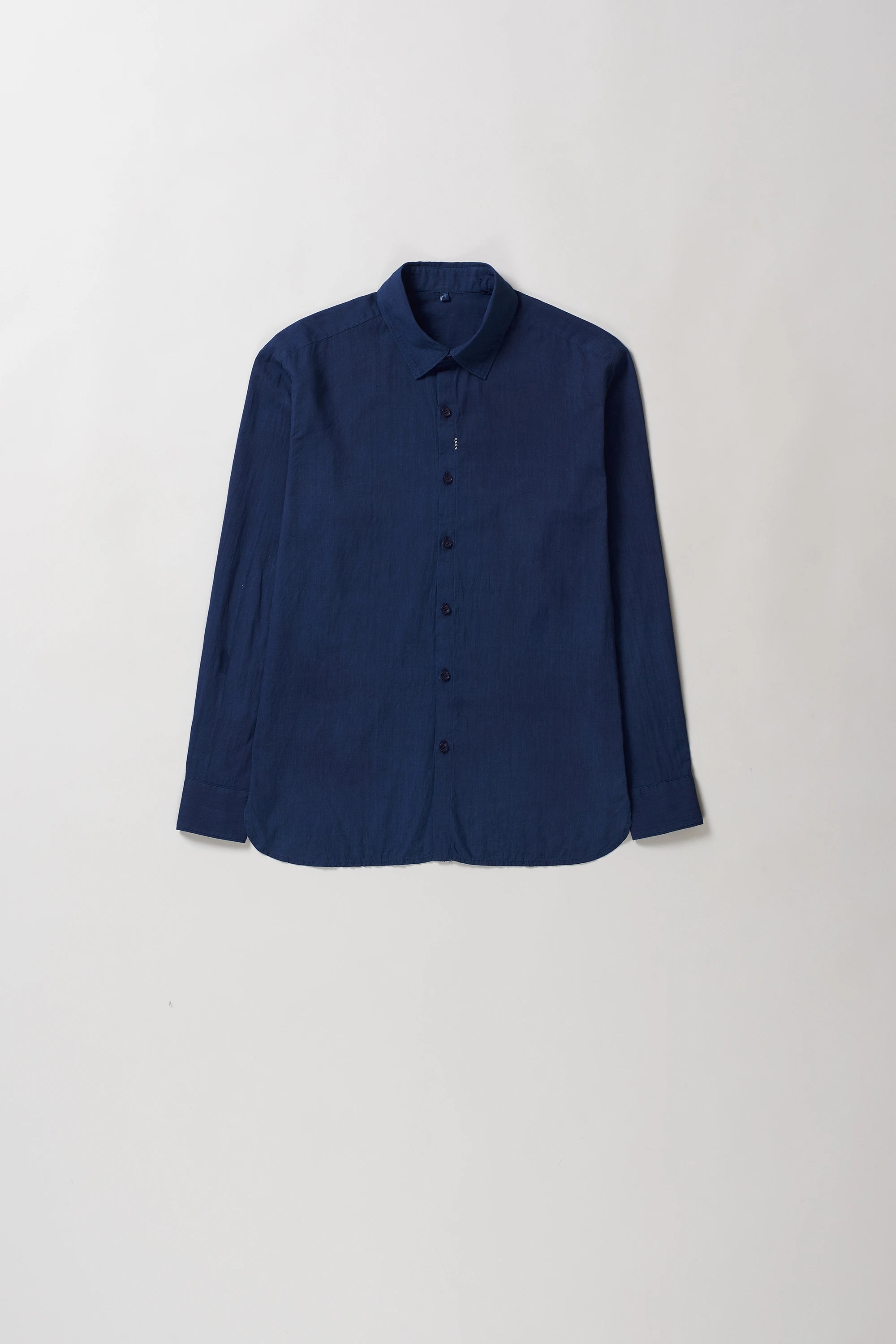 Front image of indigo cotton shirt on a grey background