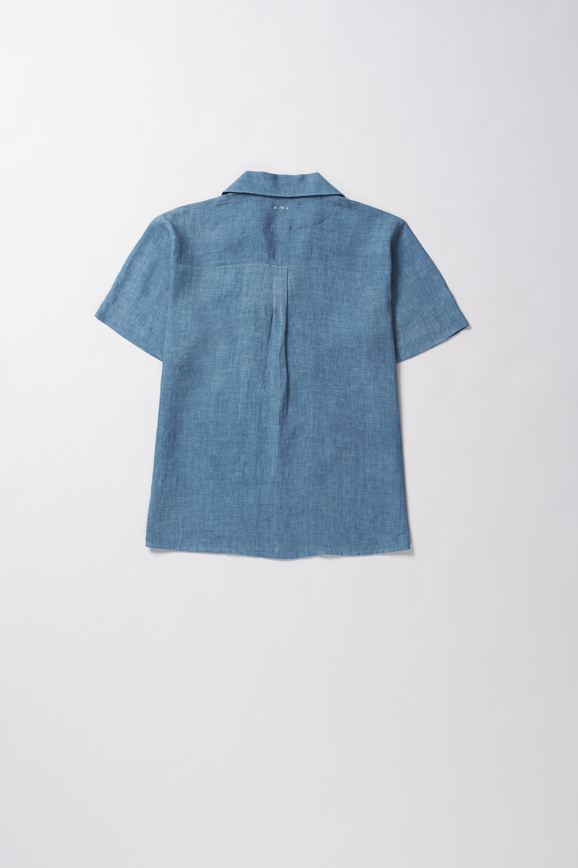 Blue shirt on a light grey background