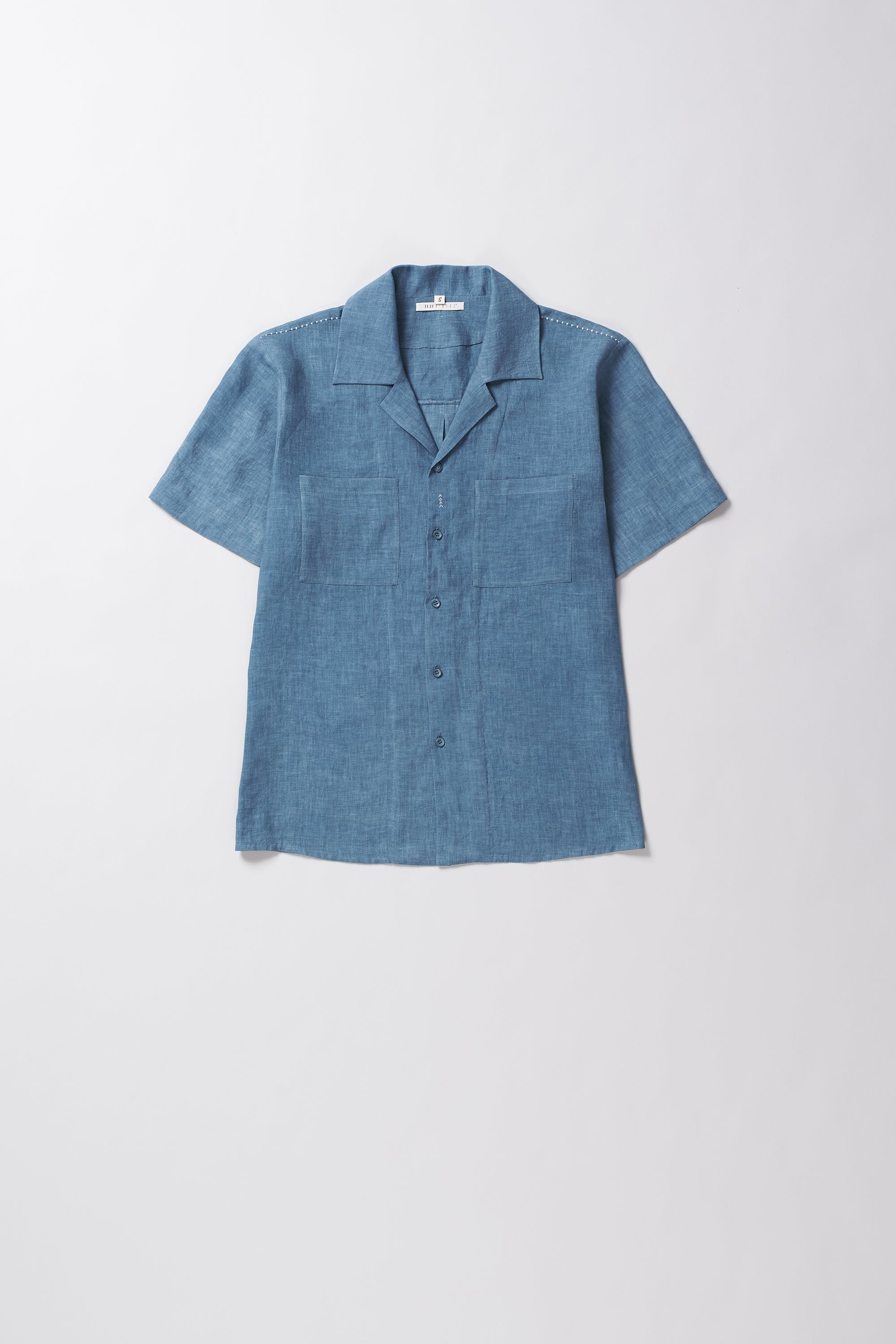 Blue short-sleeve shirt on a white background