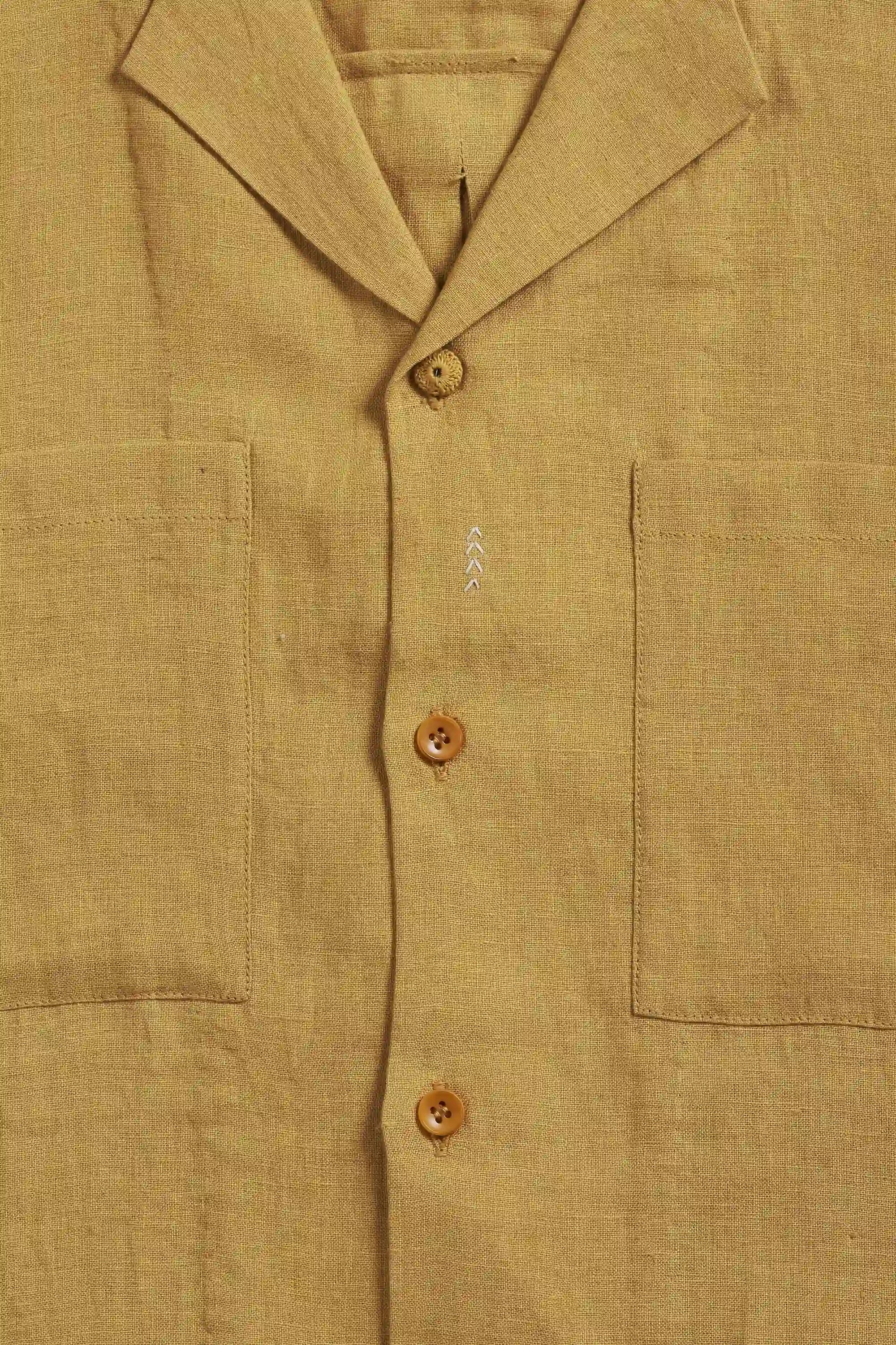 Close-up of a linen shirt with buttons and pockets