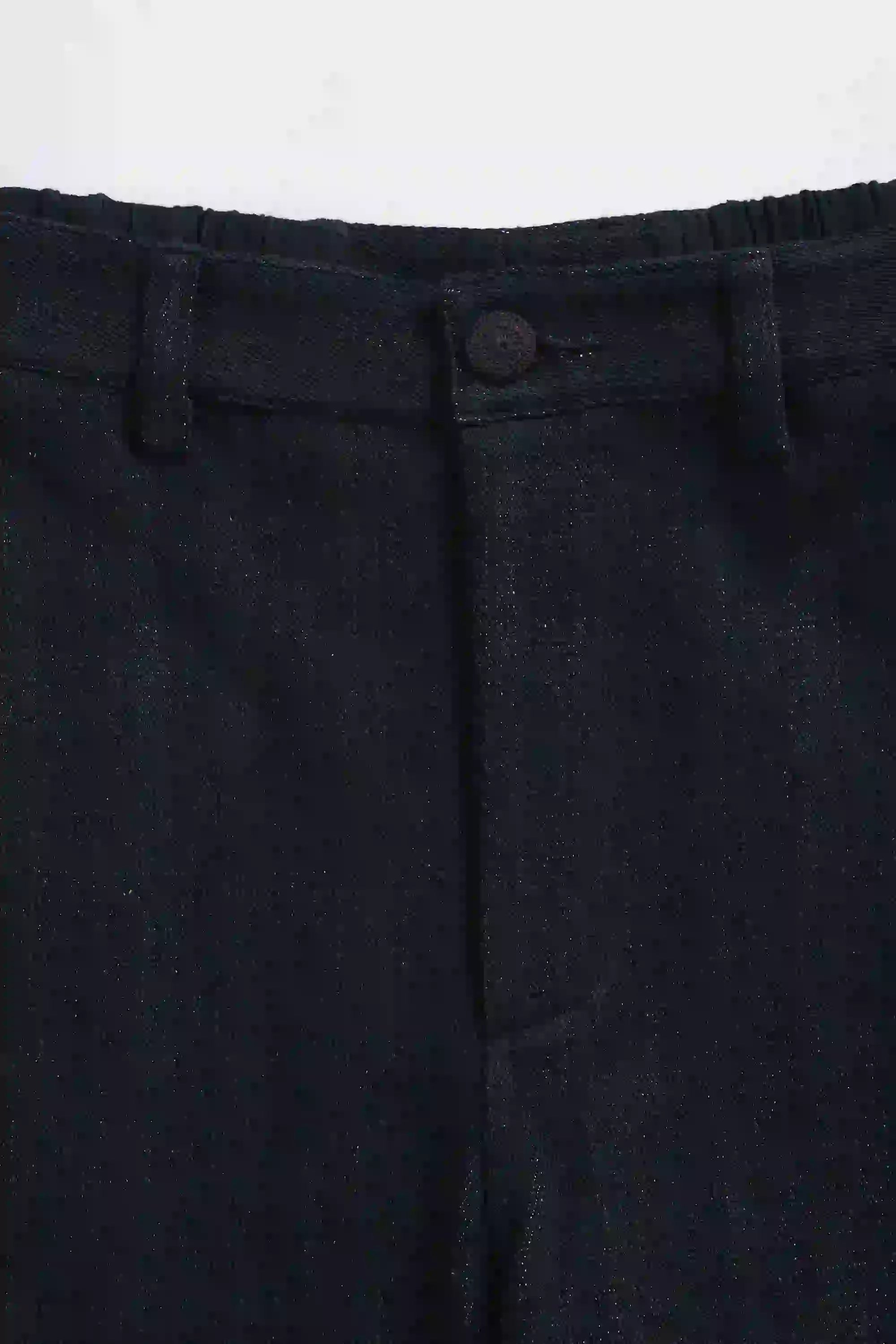 Dark gray pants with a button on a white background