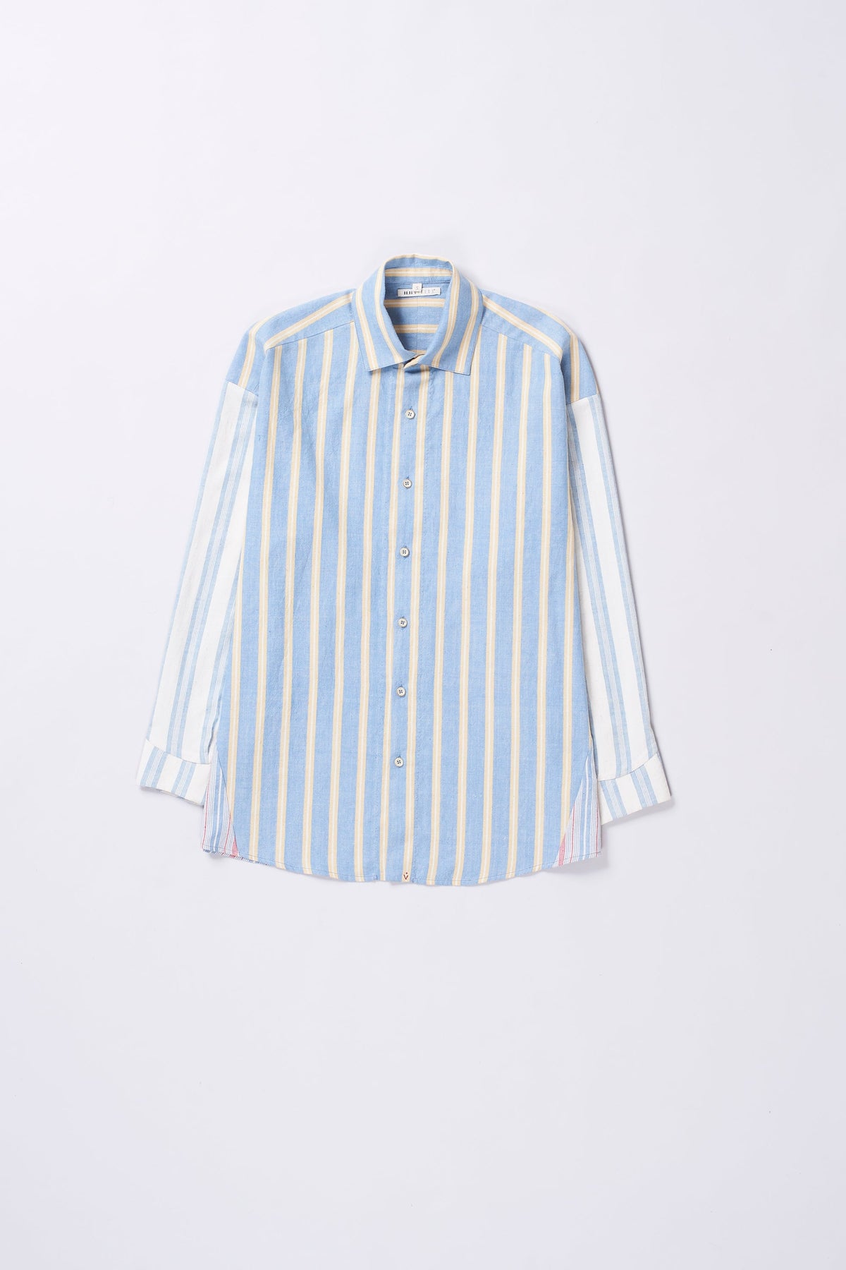 Blue and white striped shirt on a light grey background