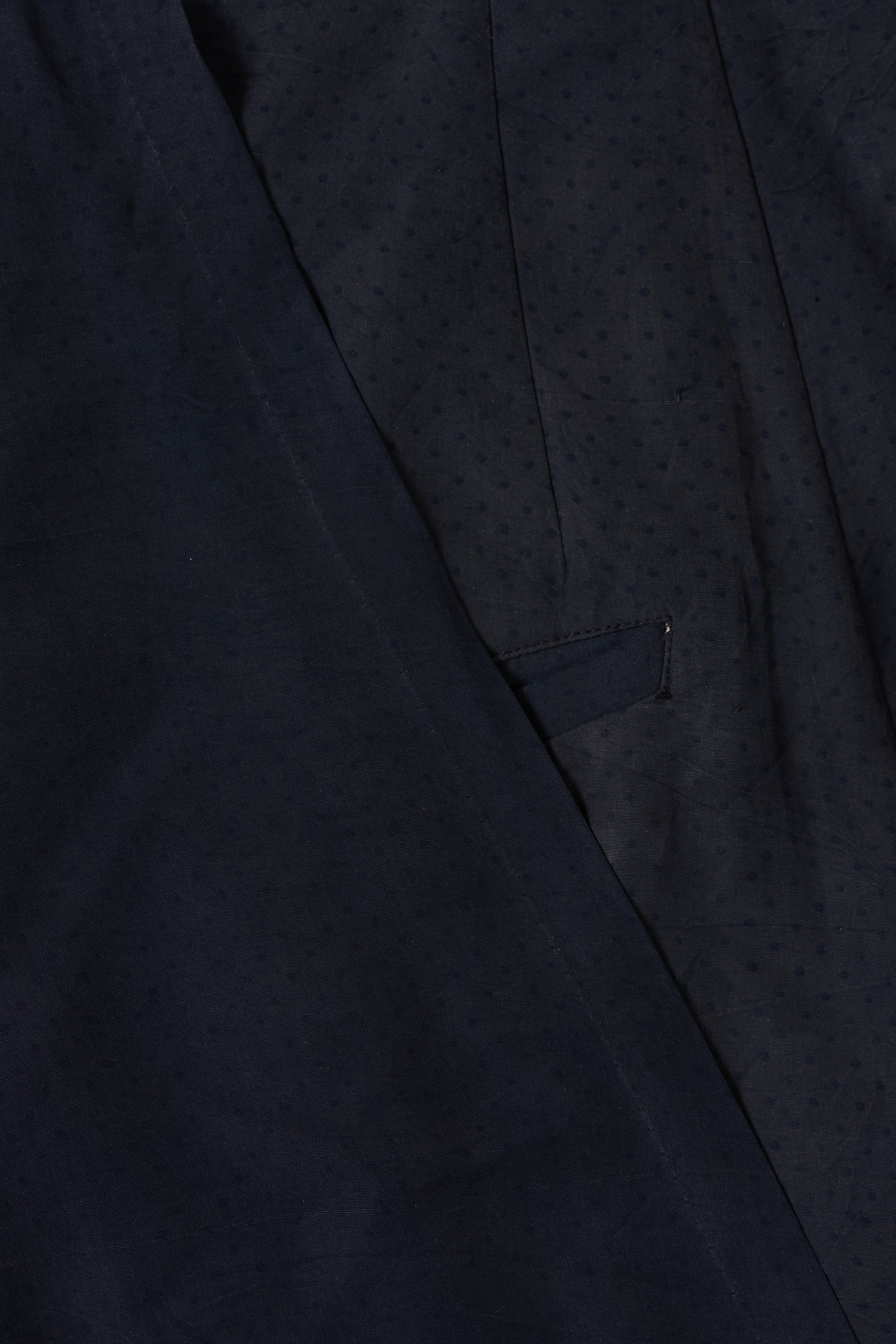 A woman wearing black pant