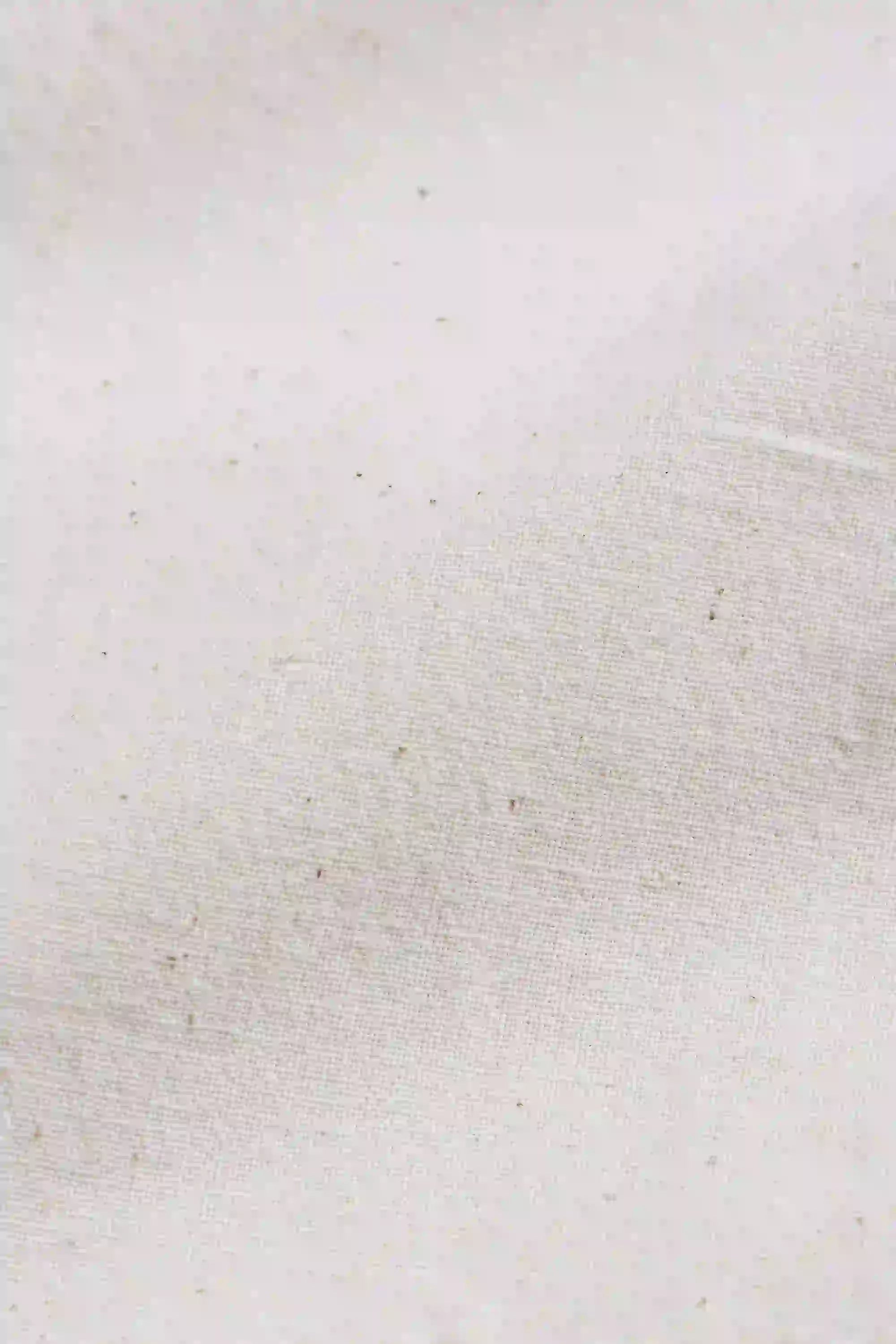 Close-up of a textured white fabric surface