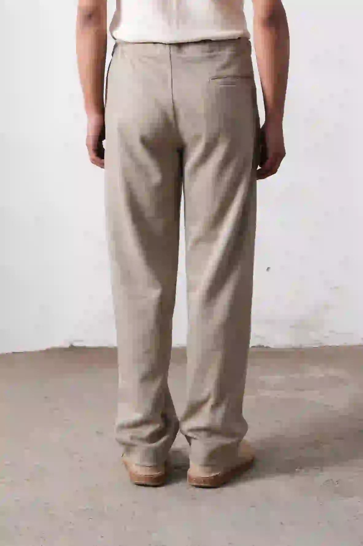 A back shot of man wearing ash grey trouser