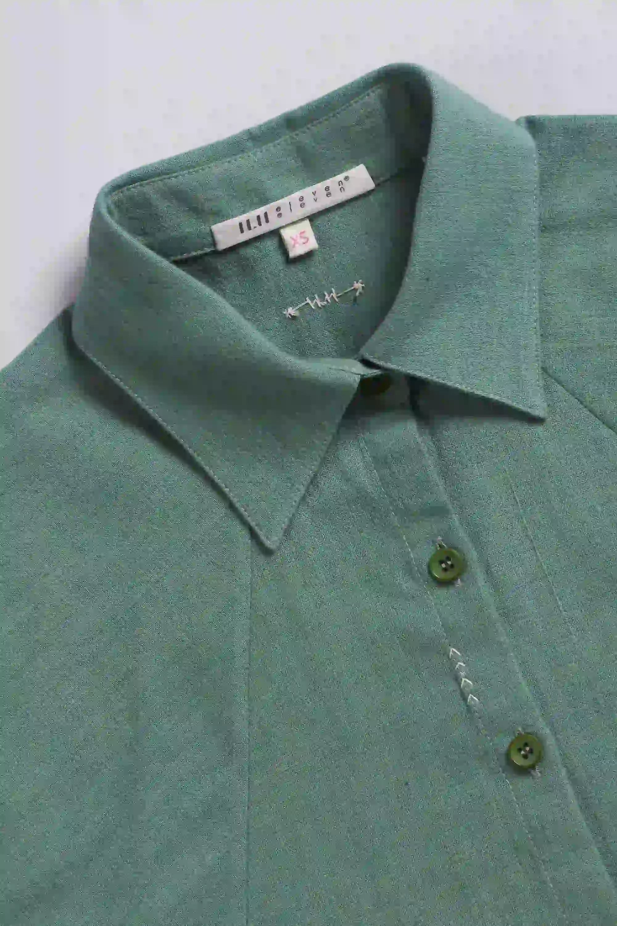 Fabric close-up with buttons and collar