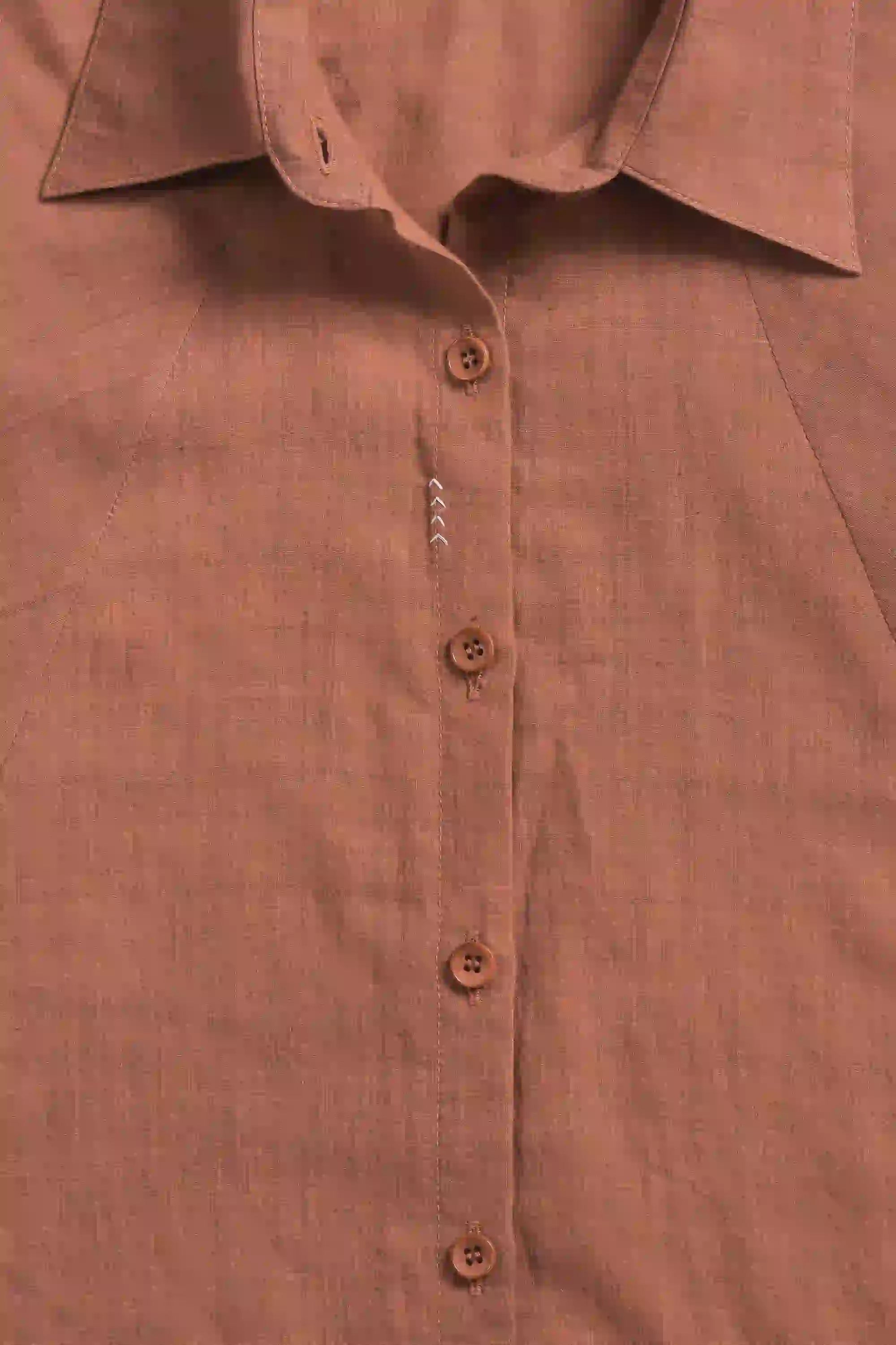 Fabric close-up with buttons and collar