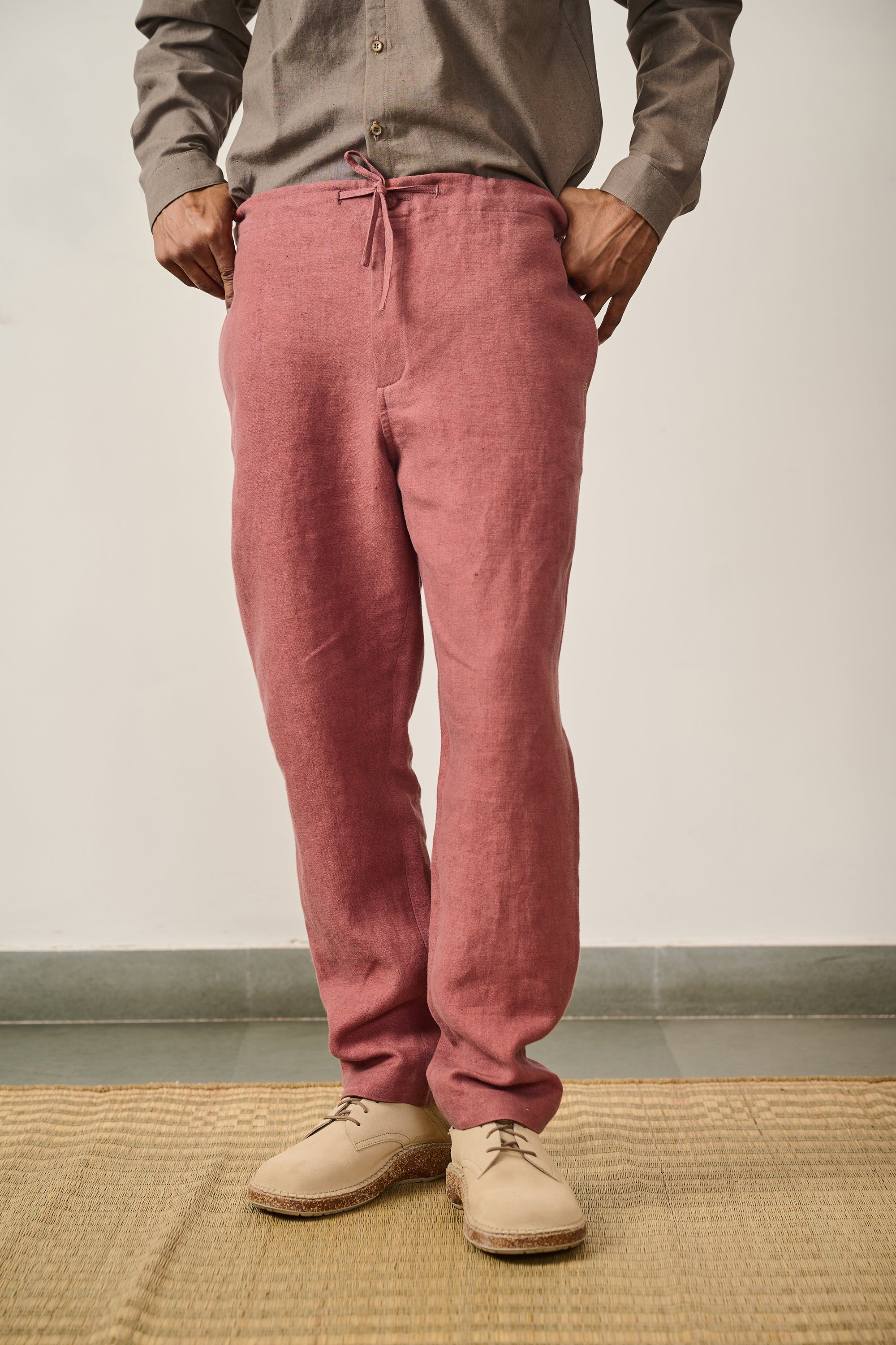 A man wearing rouge pink pant