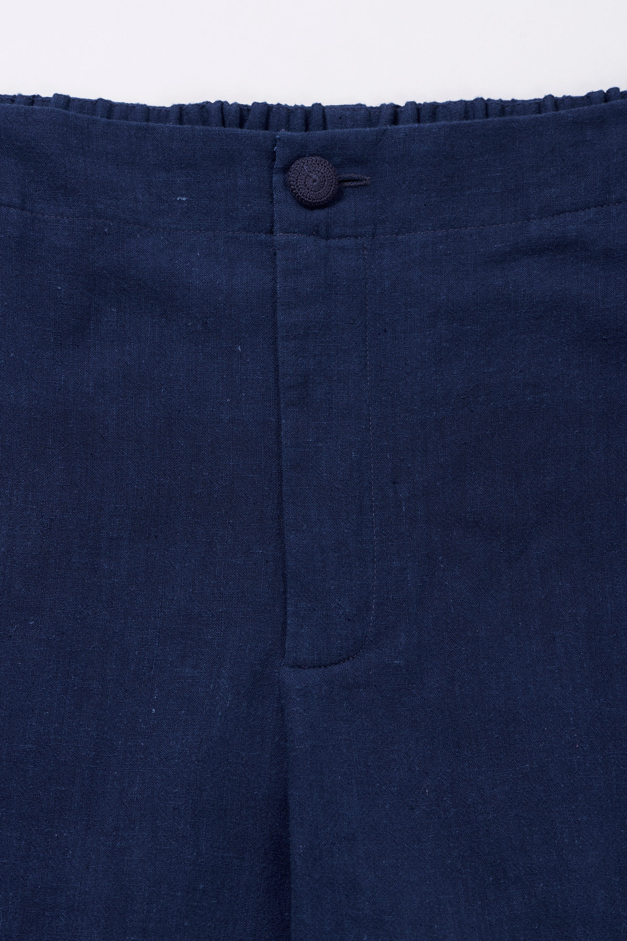 TAPERED FIT TROUSERS IN INDIGO