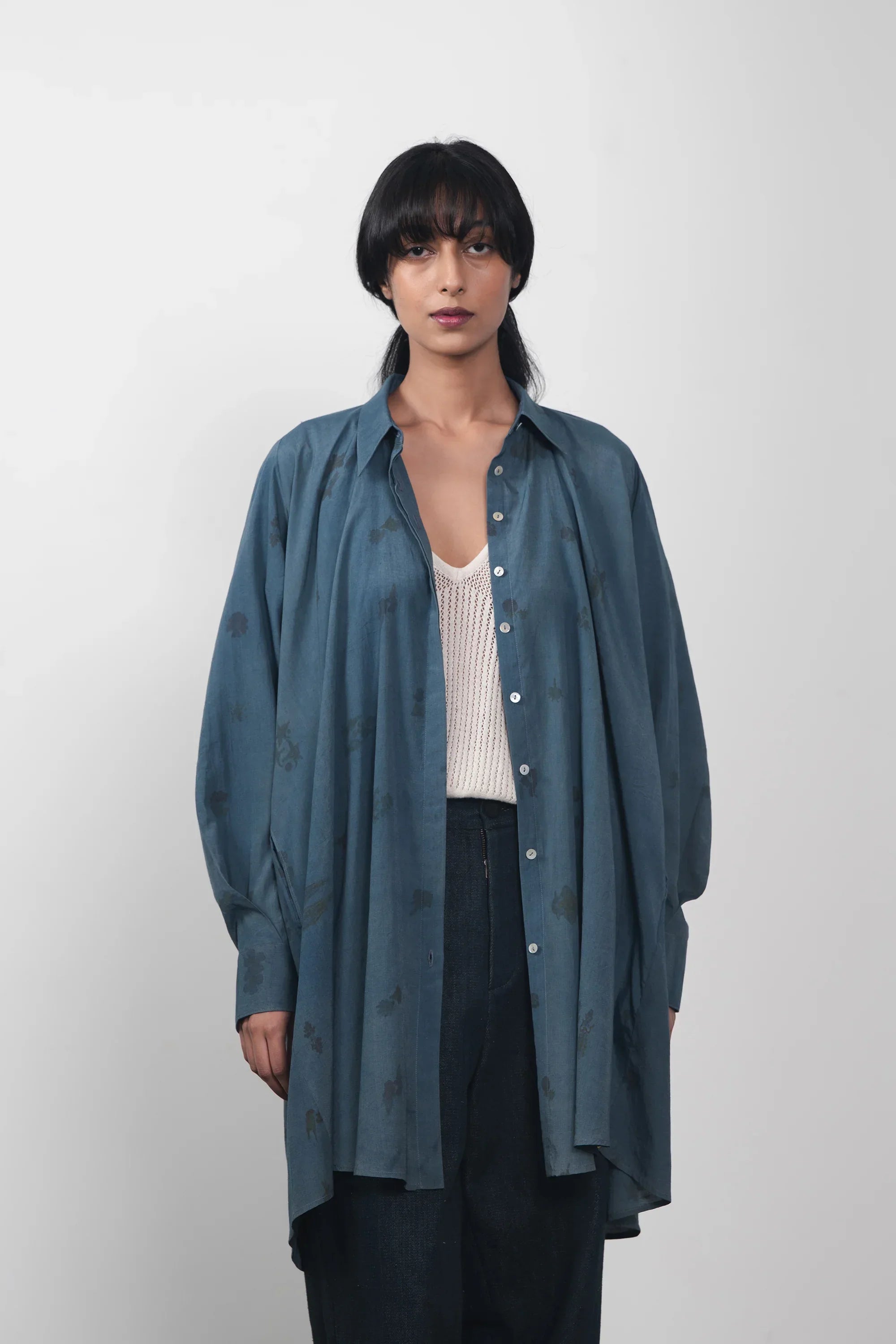 A women wearing estate blue shirt