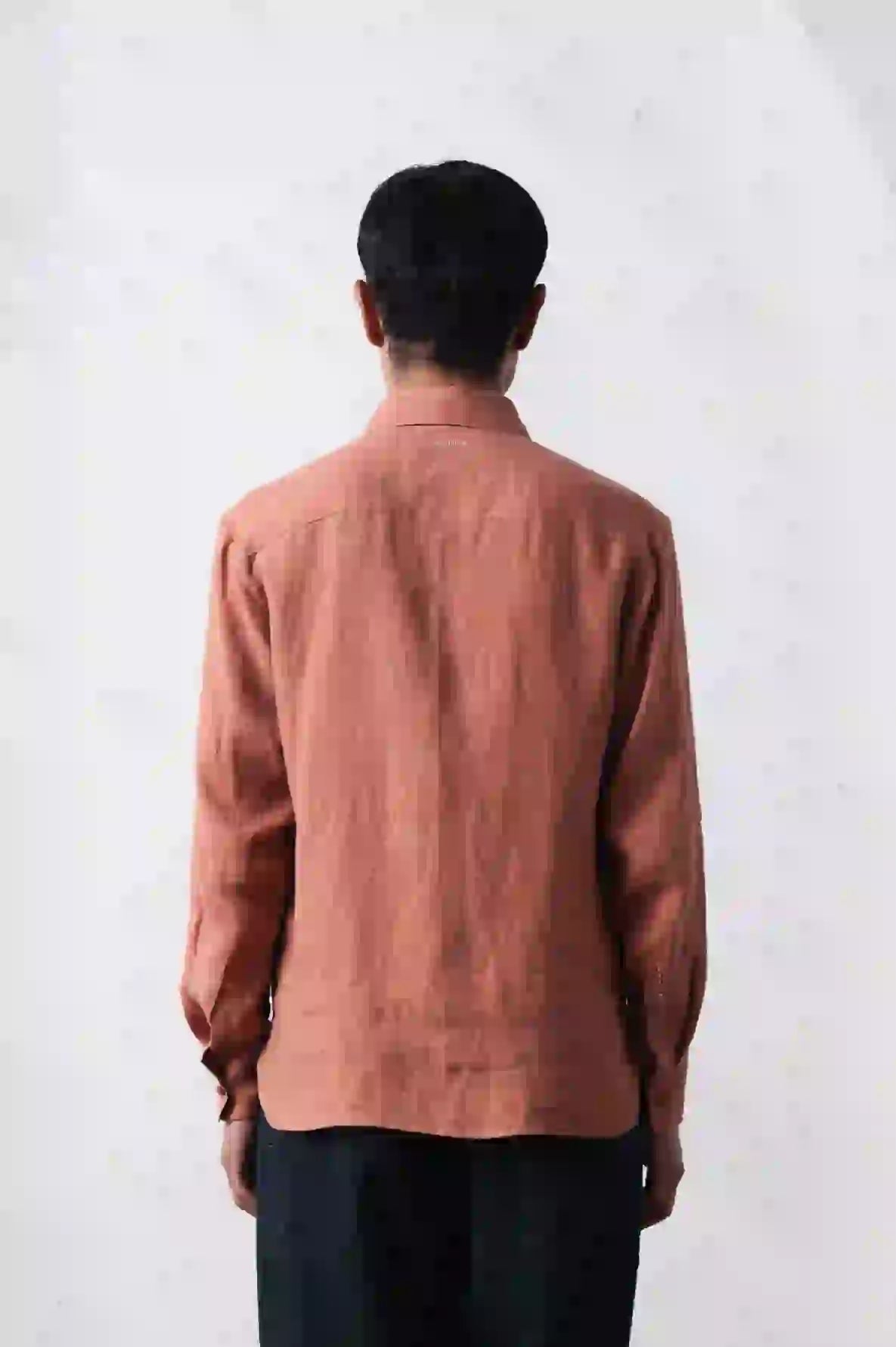 A back shot of man wearing lovers shirt