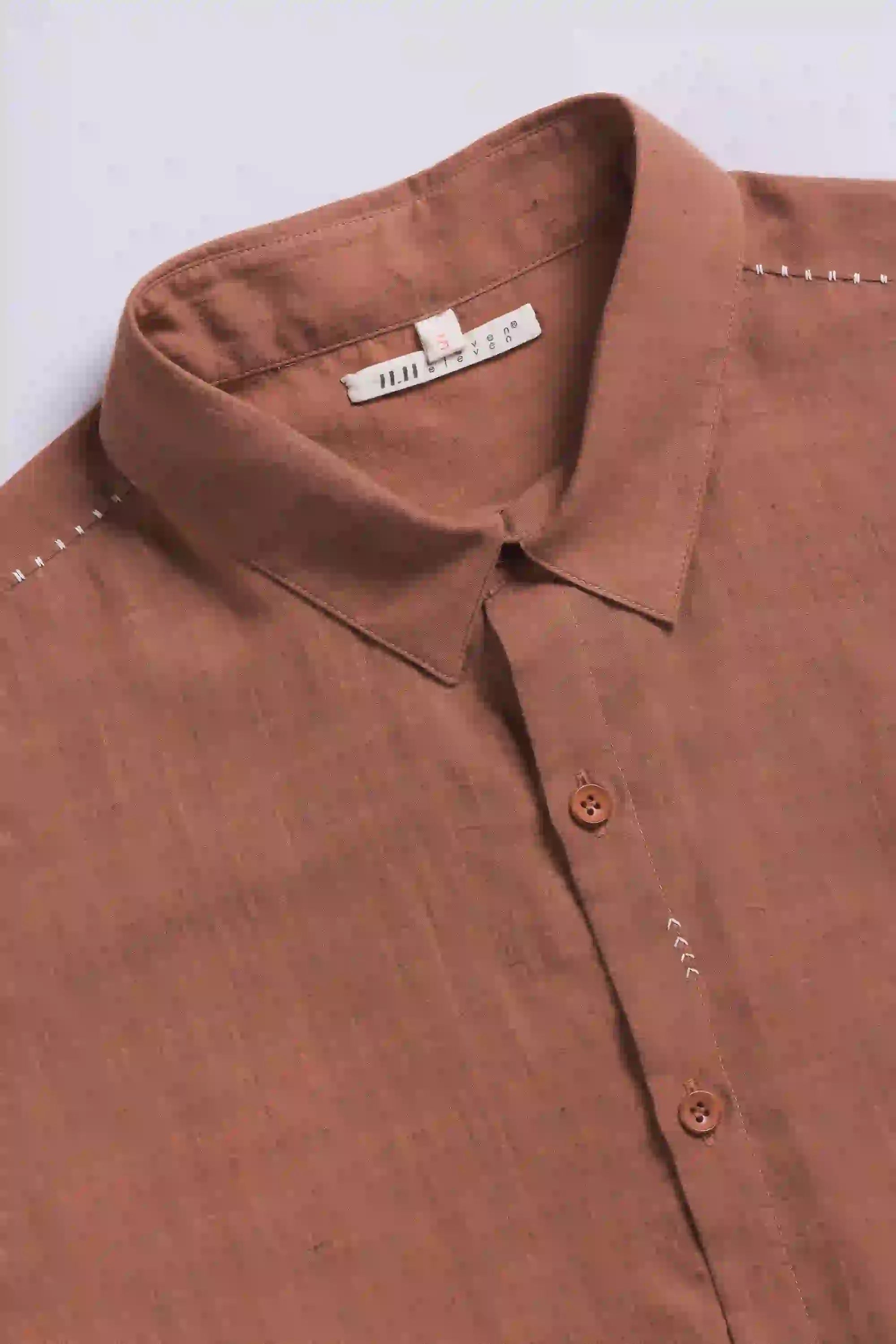 Fabric close-up with buttons and collar