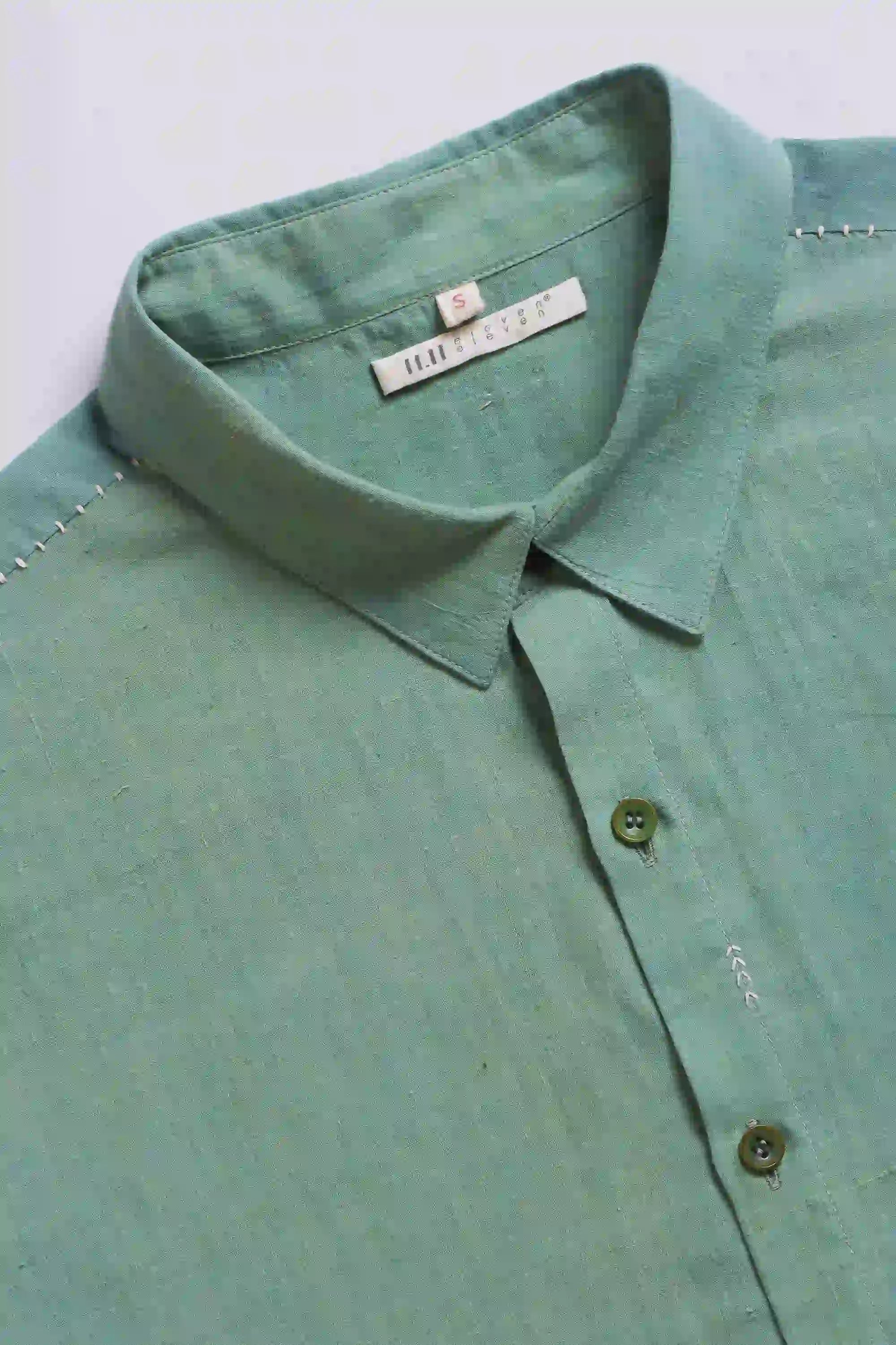 Fabric close-up with buttons and collar