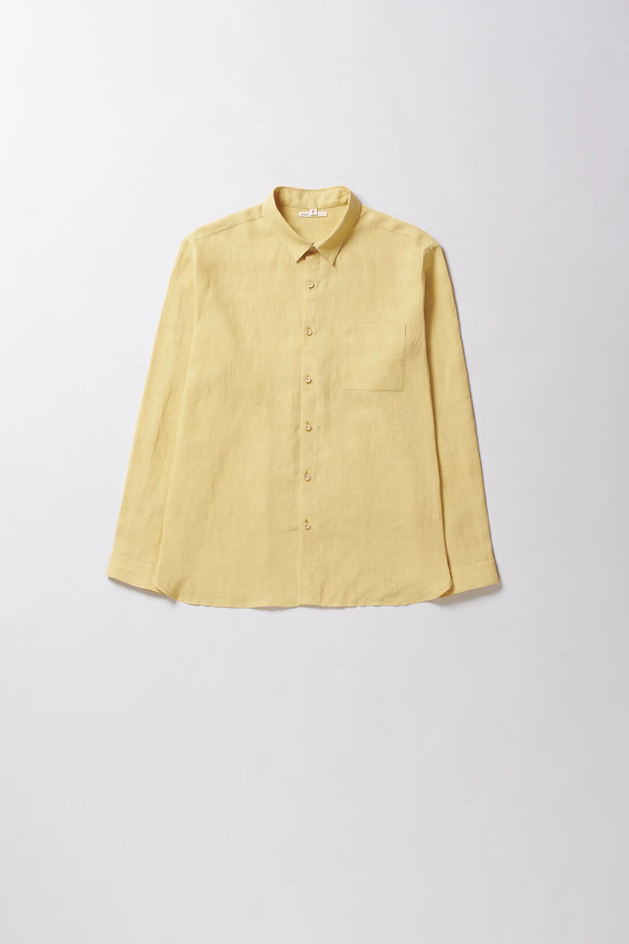Yellow shirt on a light grey background