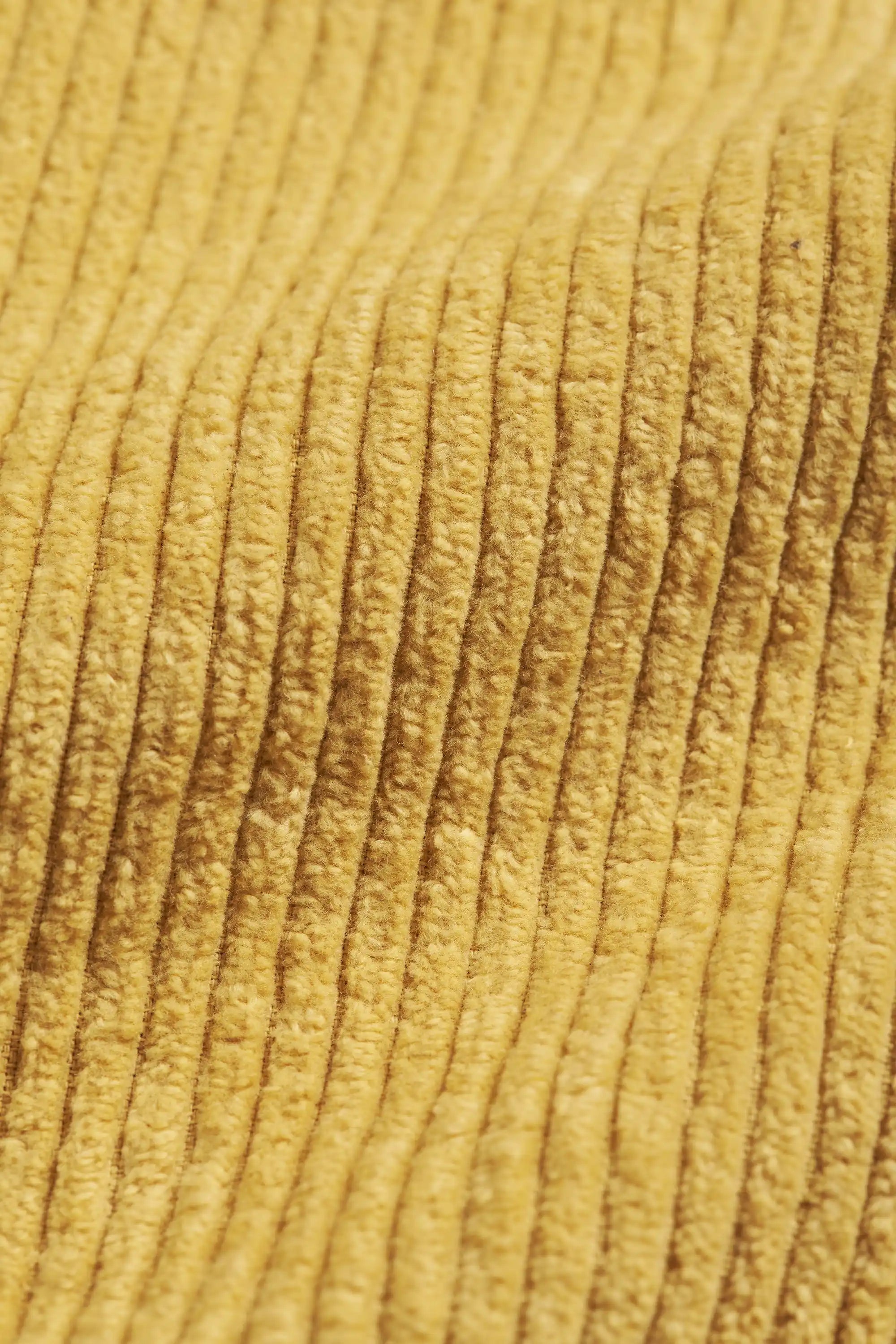 Close-up of ochre yellow fabric