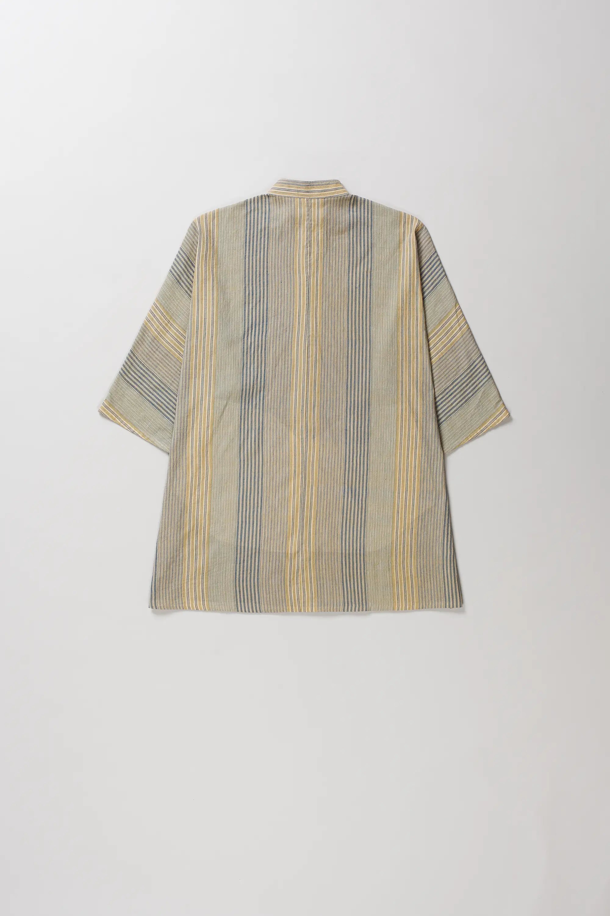Back shot of shirt with vertical stripes in yellow, blue, and gray on a beige base, shown from the back against a light gray background.