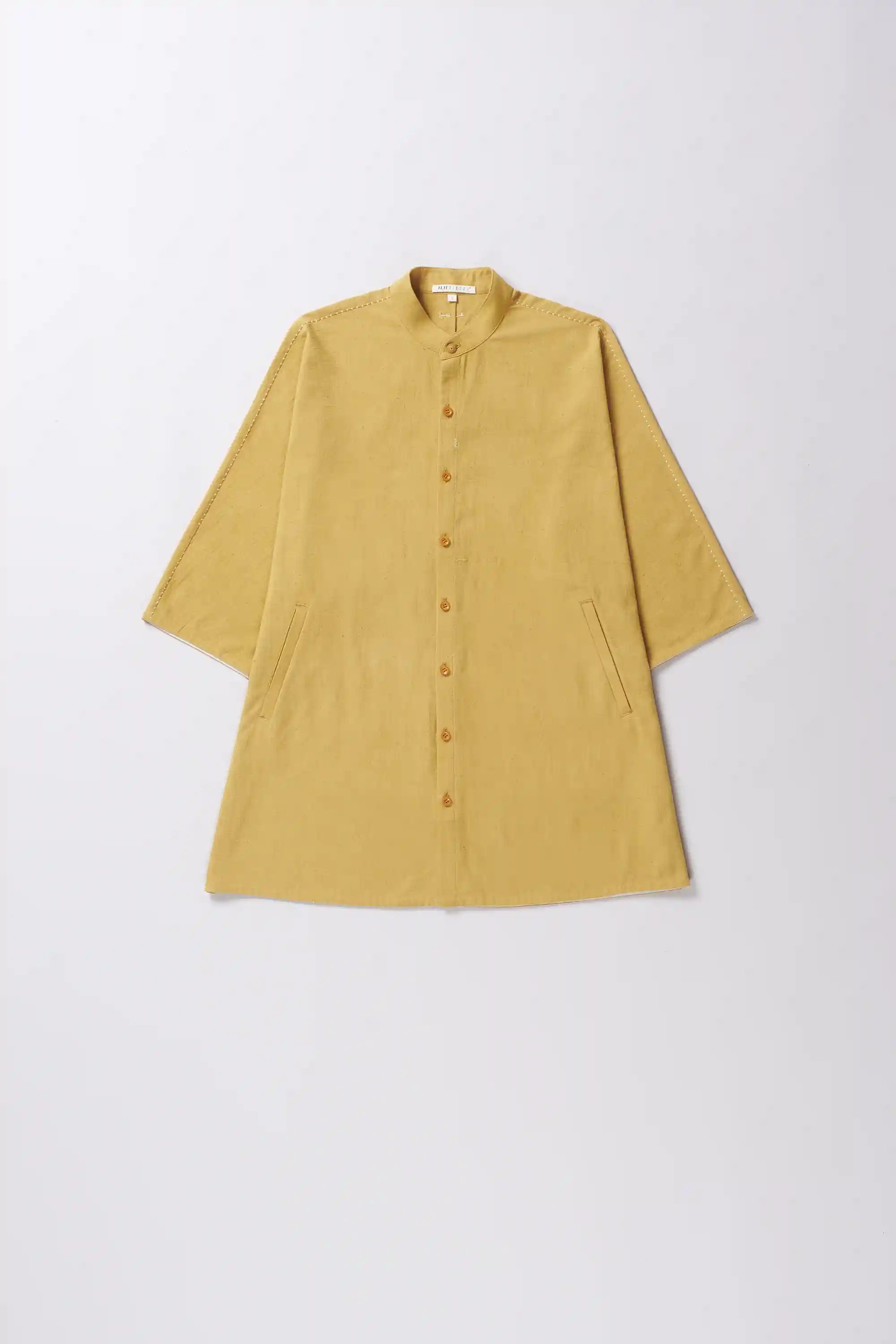 Front image of a cotton ochre yellow shirt