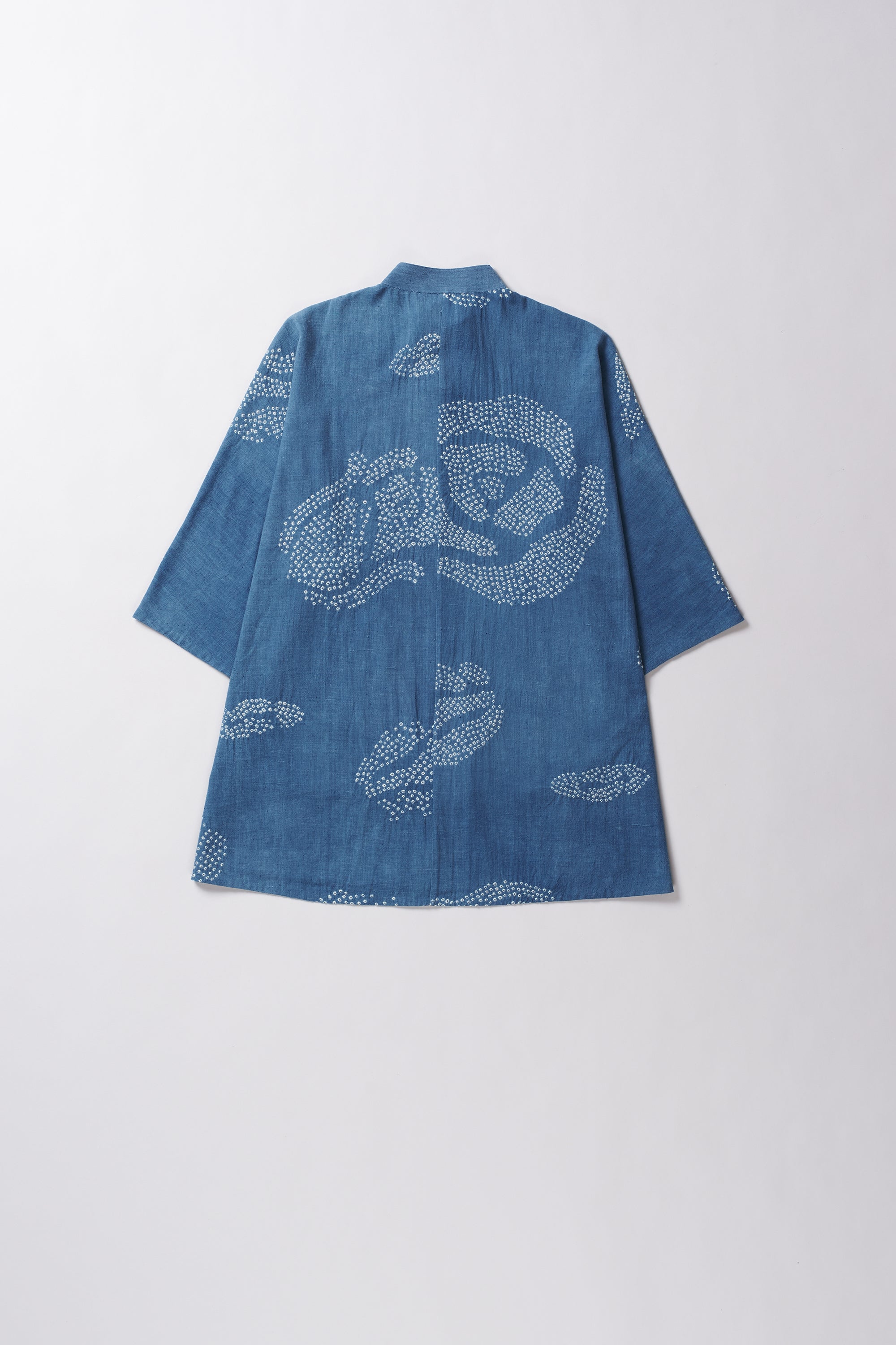 Blue shirt with bandhani on a light grey background
