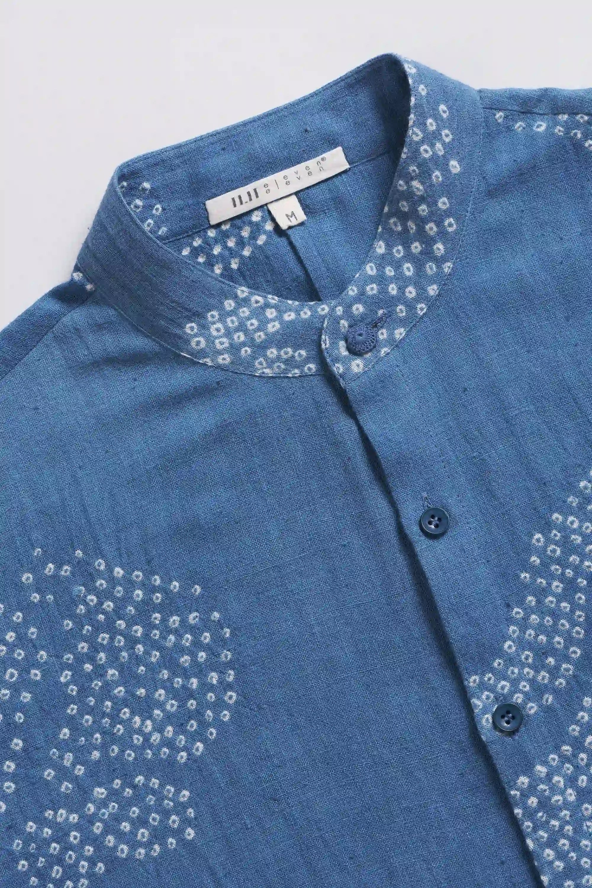 Fabric close-up with buttons and band collar