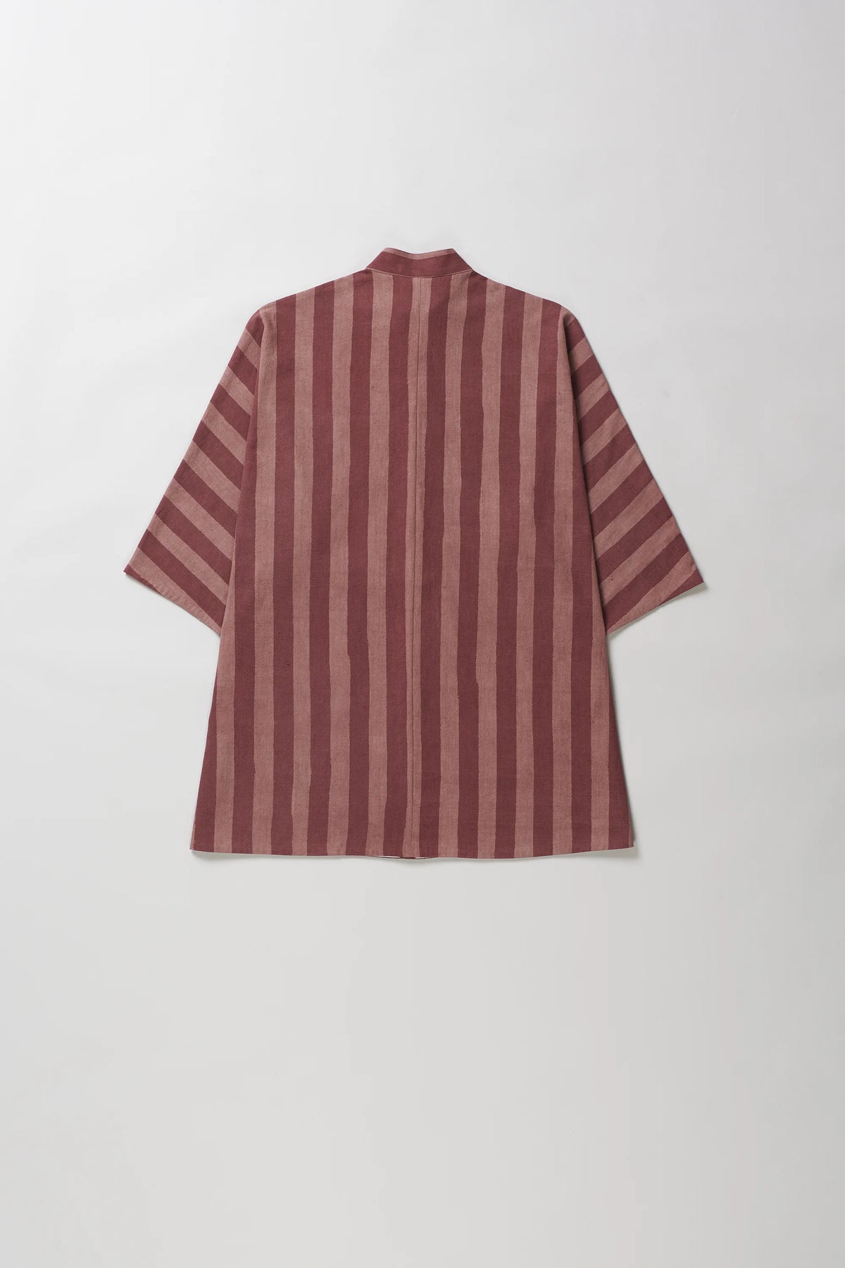 A short-sleeve striped shirt with a high collar, shown from the back. The fabric features vertical stripes in dusty rose and dark brown, laid flat against a light grey background.
