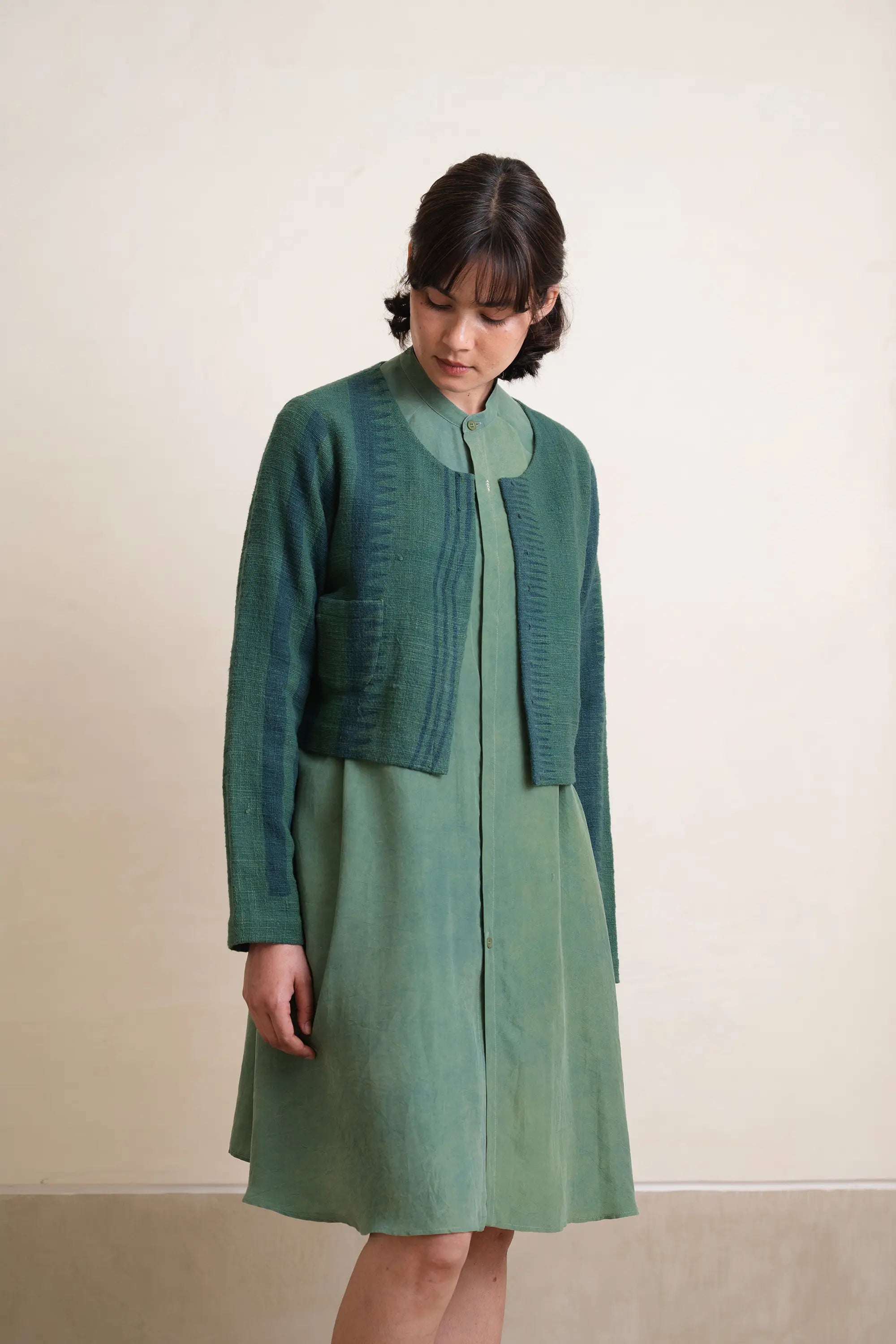 A woman wearing cotton jacket in bottel green