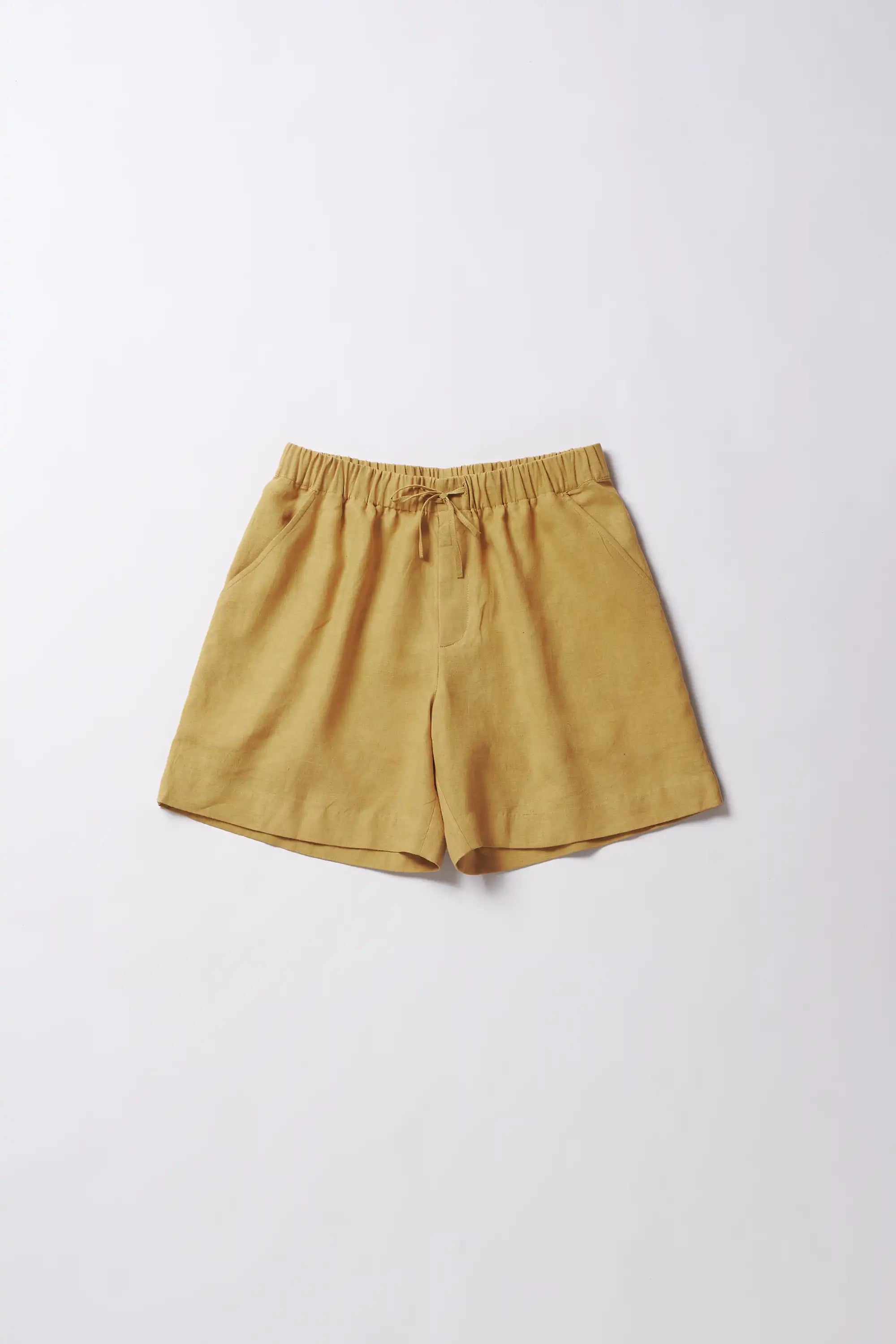 Front image of a ochre yellow linen shirt