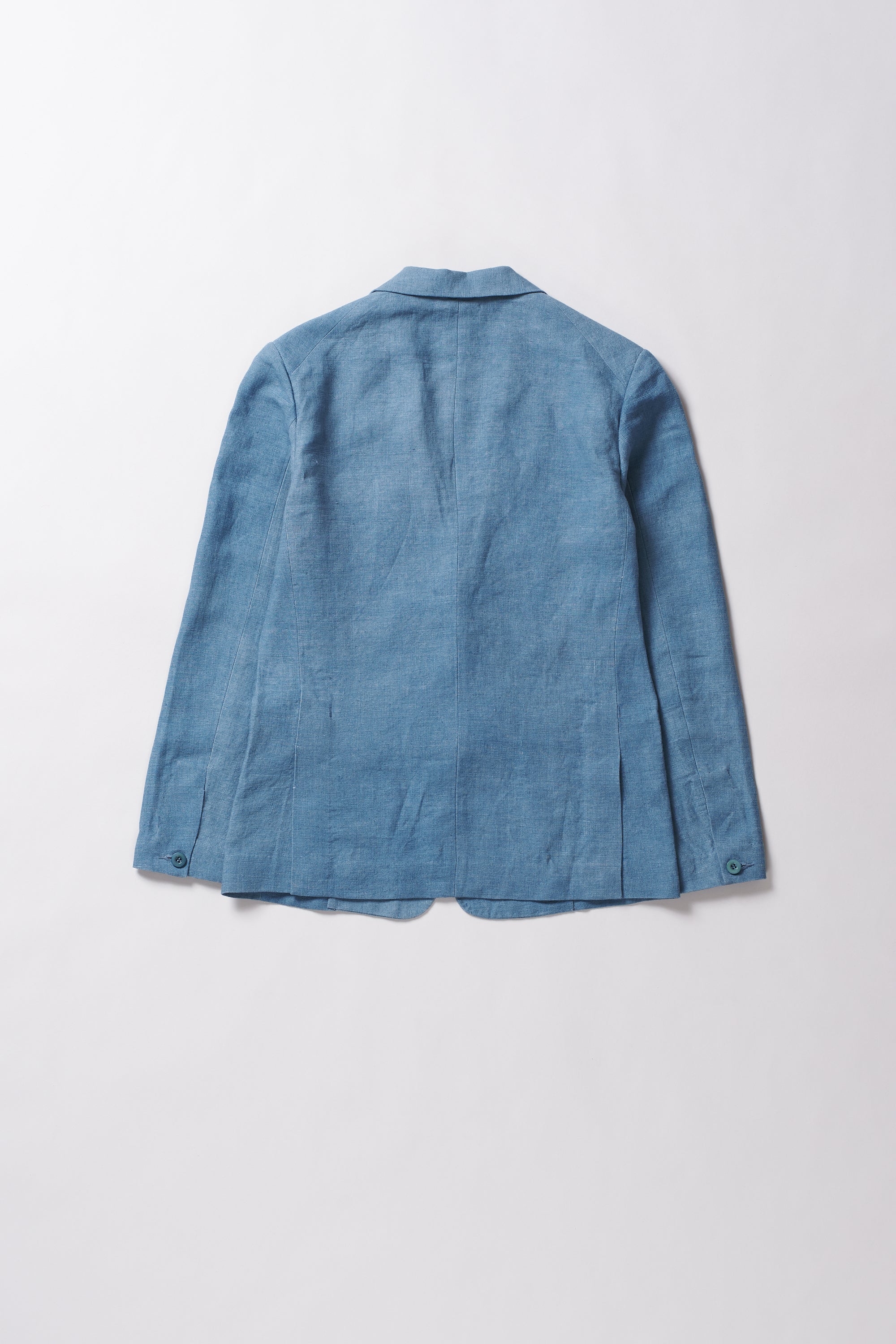 Blue linen jacket on a light grey background
