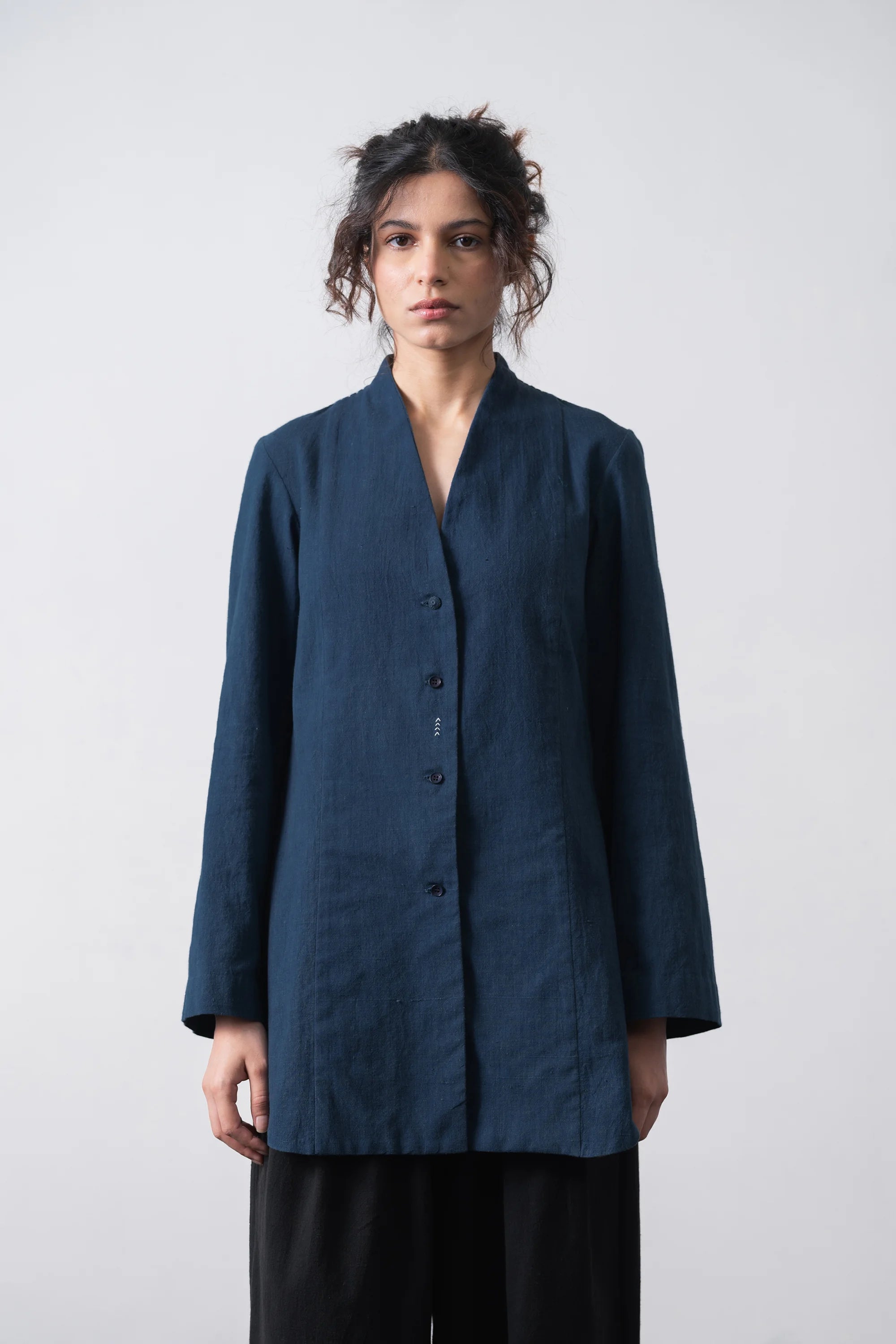 A woman wearing cotton space blue shirt