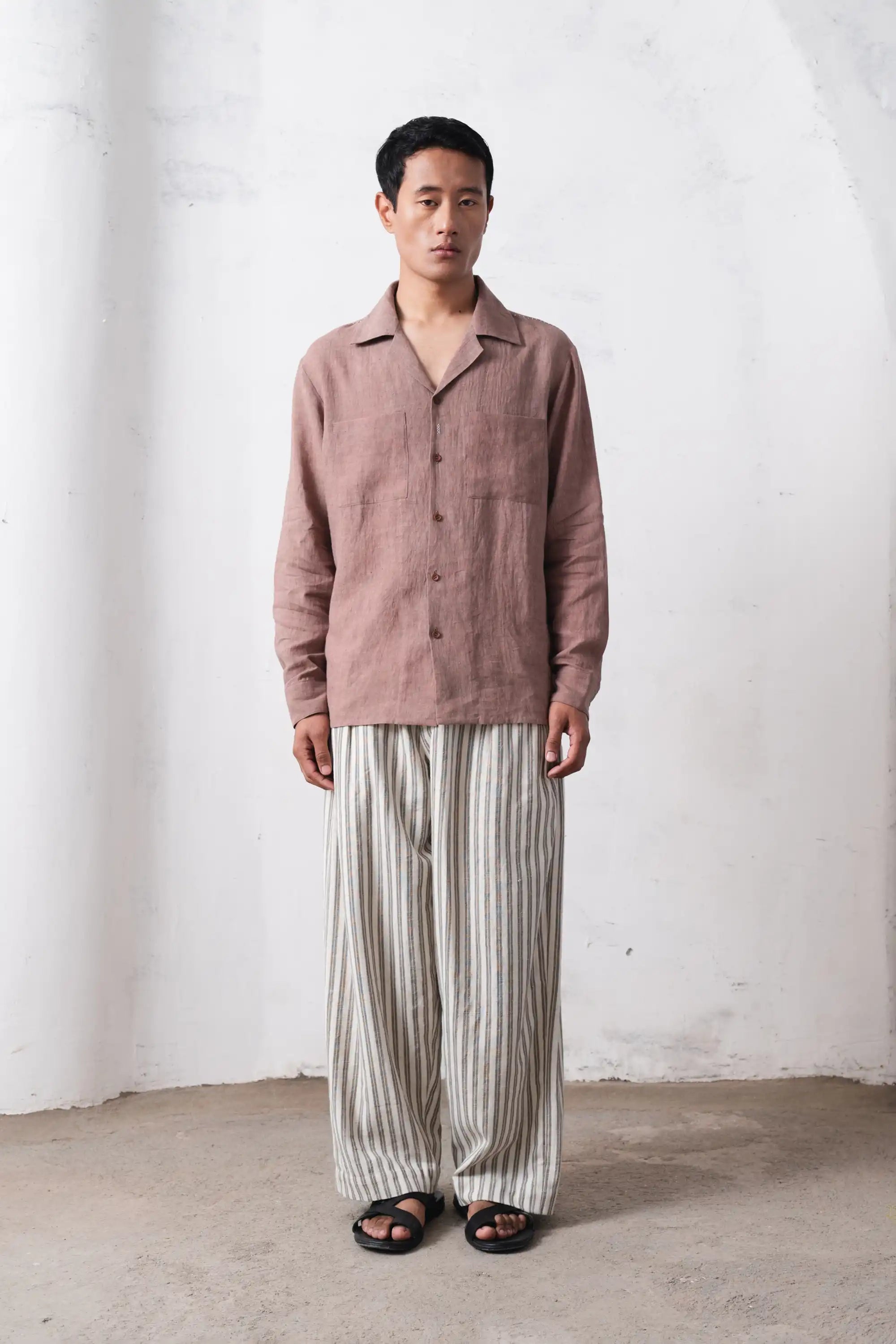 A man wearing old rose shirt