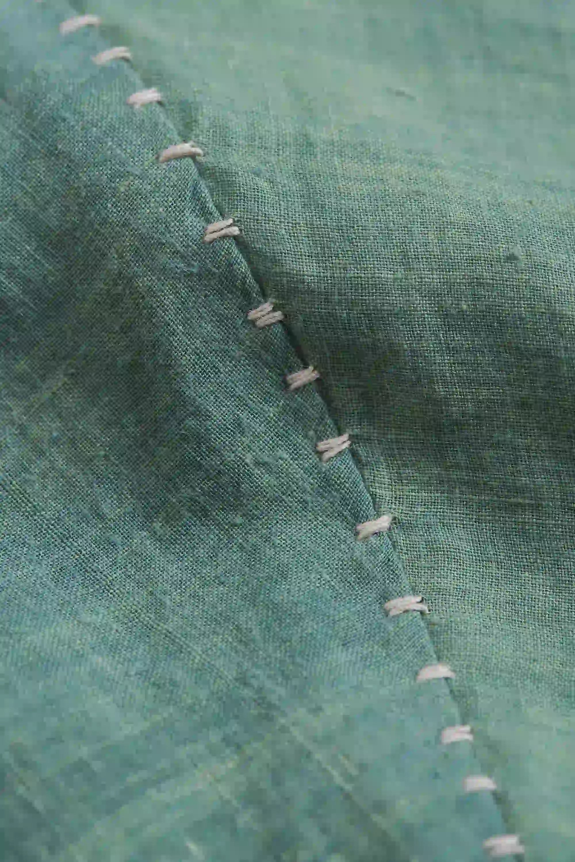 Fabric close-up with hand detailing
