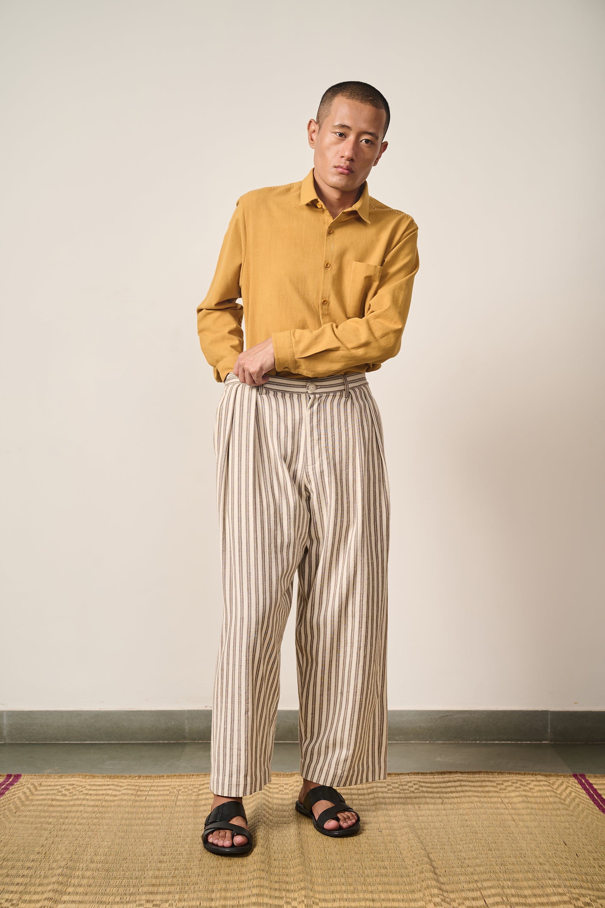 A man wearing charcoal pant