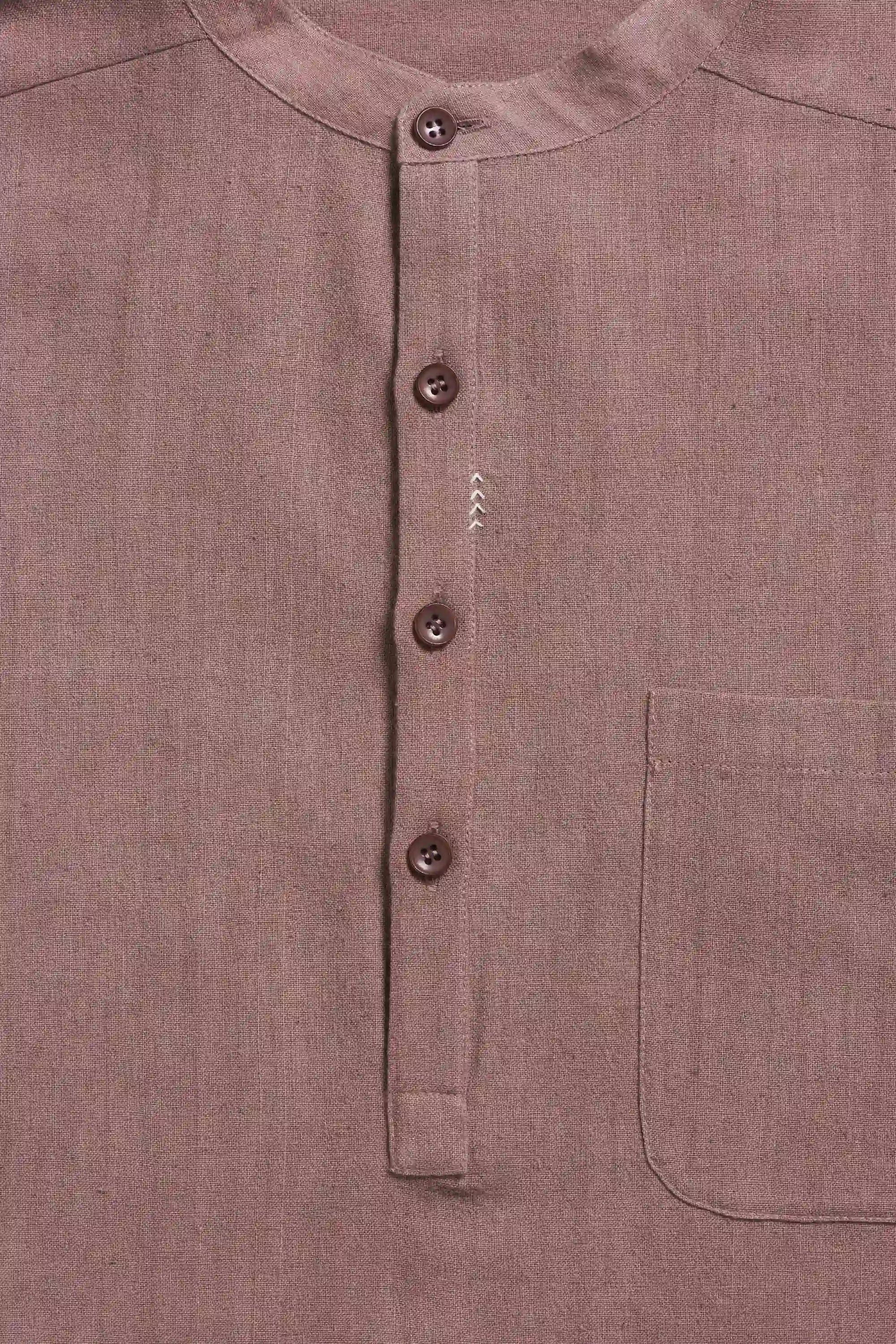 Close-up of a old rose shirt with buttons and a pocket